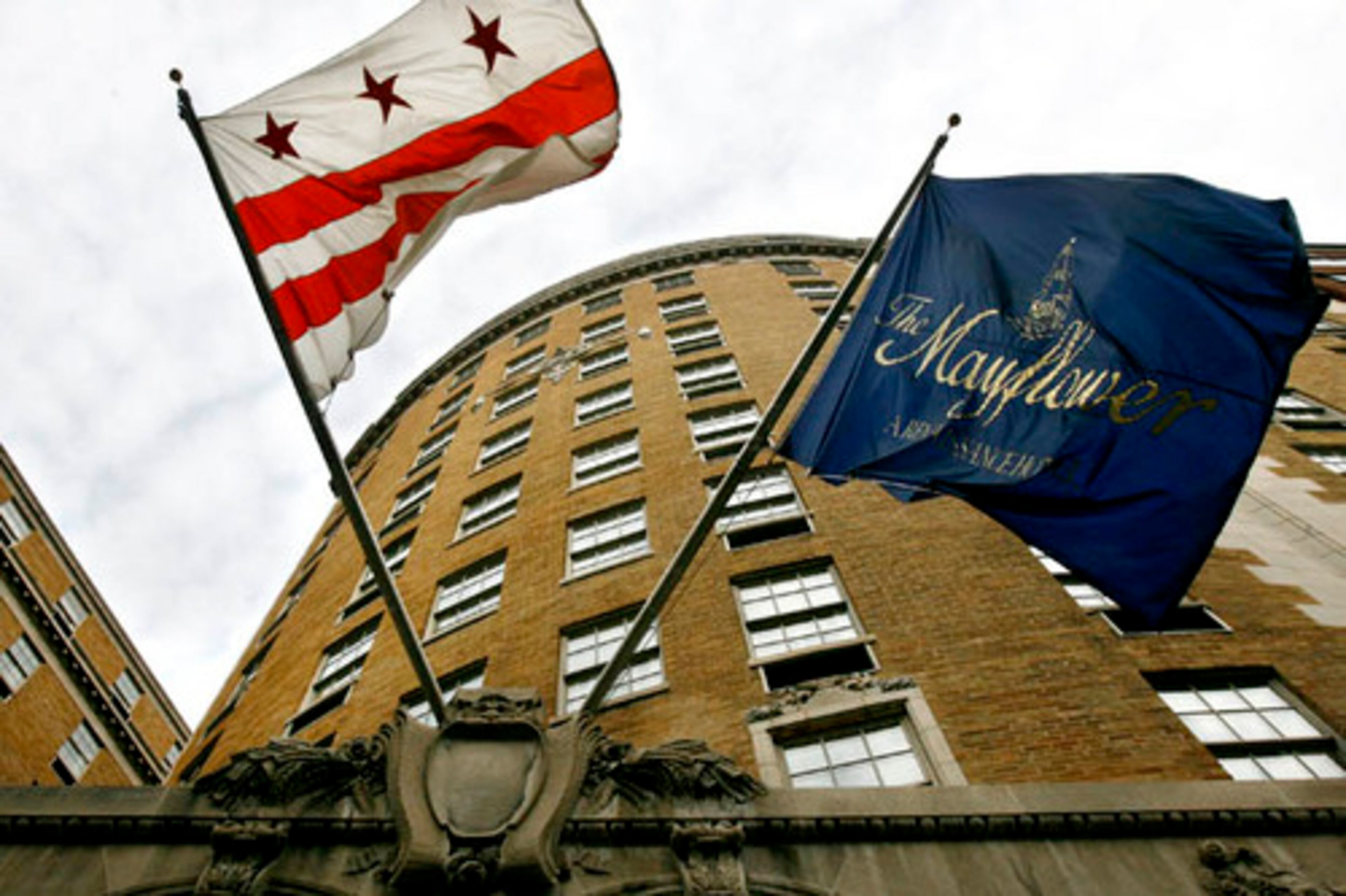 The District of Columbia flag flies next to the one for the Mayflower Hotel outside of the hotel in Washington.