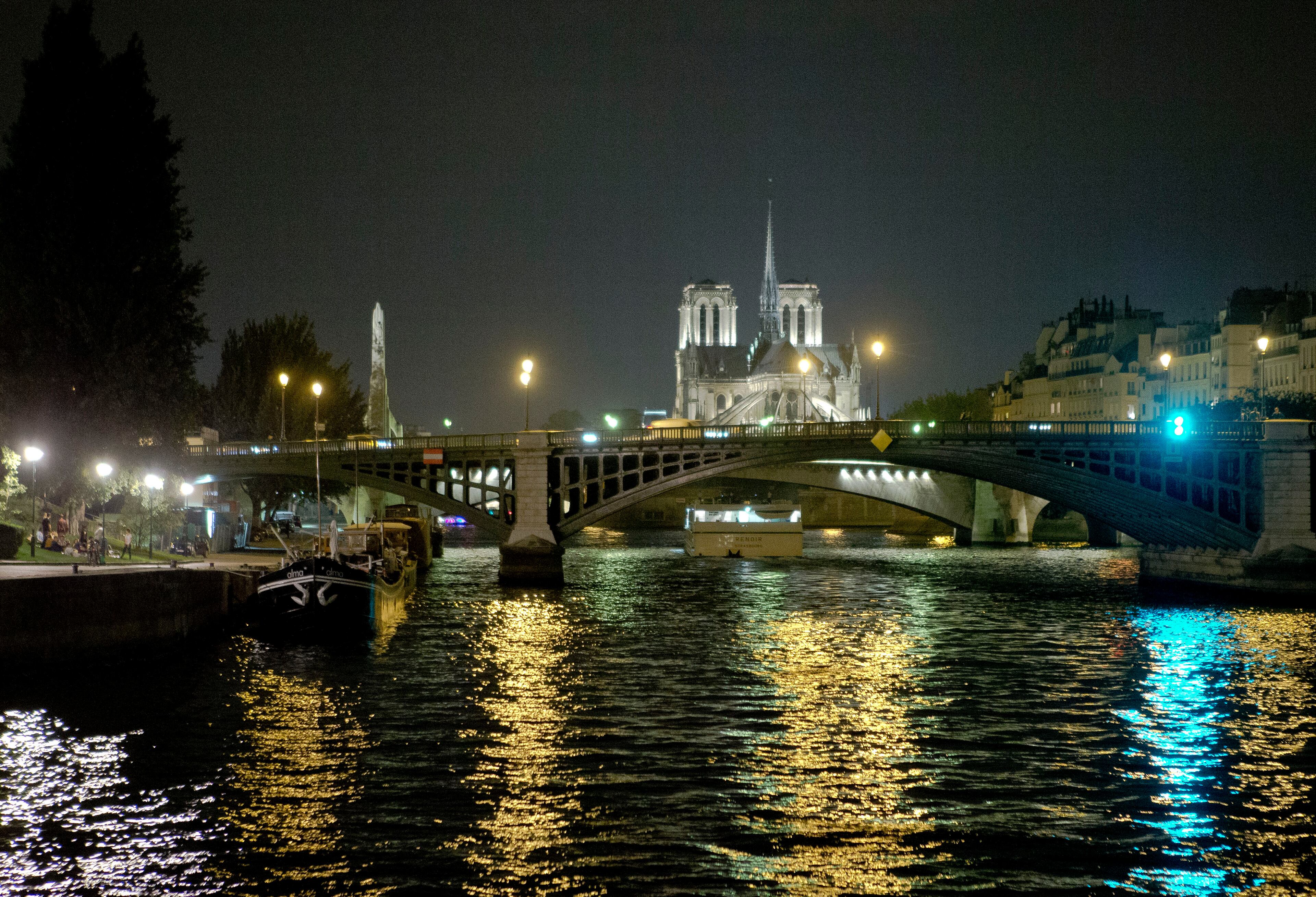 View of the Notre Dame Cathedral along the Seine river at nigth, in Paris, Wednesday, Sept. 17, 2014. (AP Photo/Jacques Brinon)