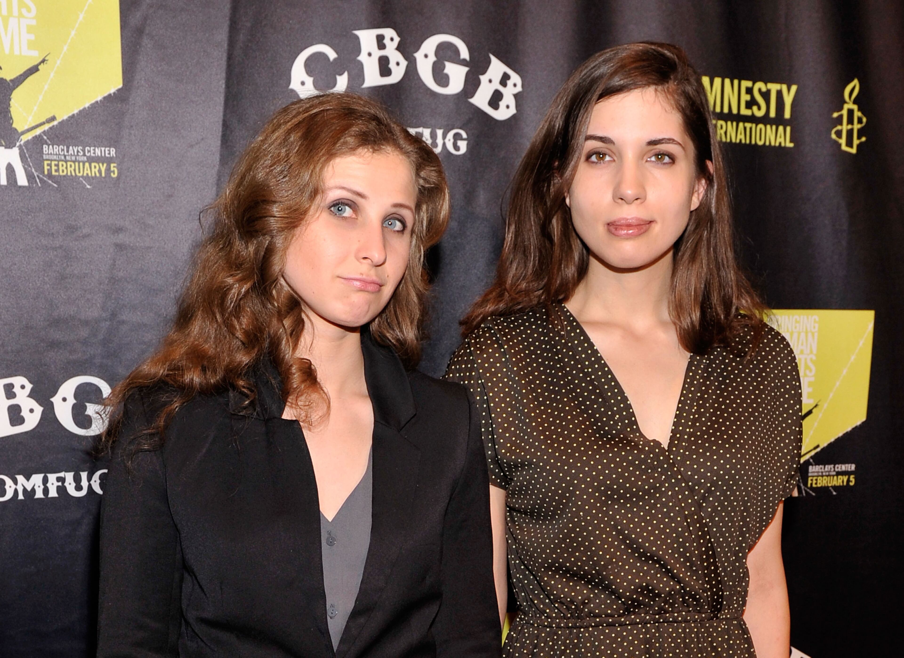 Maria Alyokhina (L) and Nadezhda Tolokonnikova of Pussy Riot attend the Amnesty International Concert presented by the CBGB Festival at Barclays Center on February 5, 2014 in New York City.