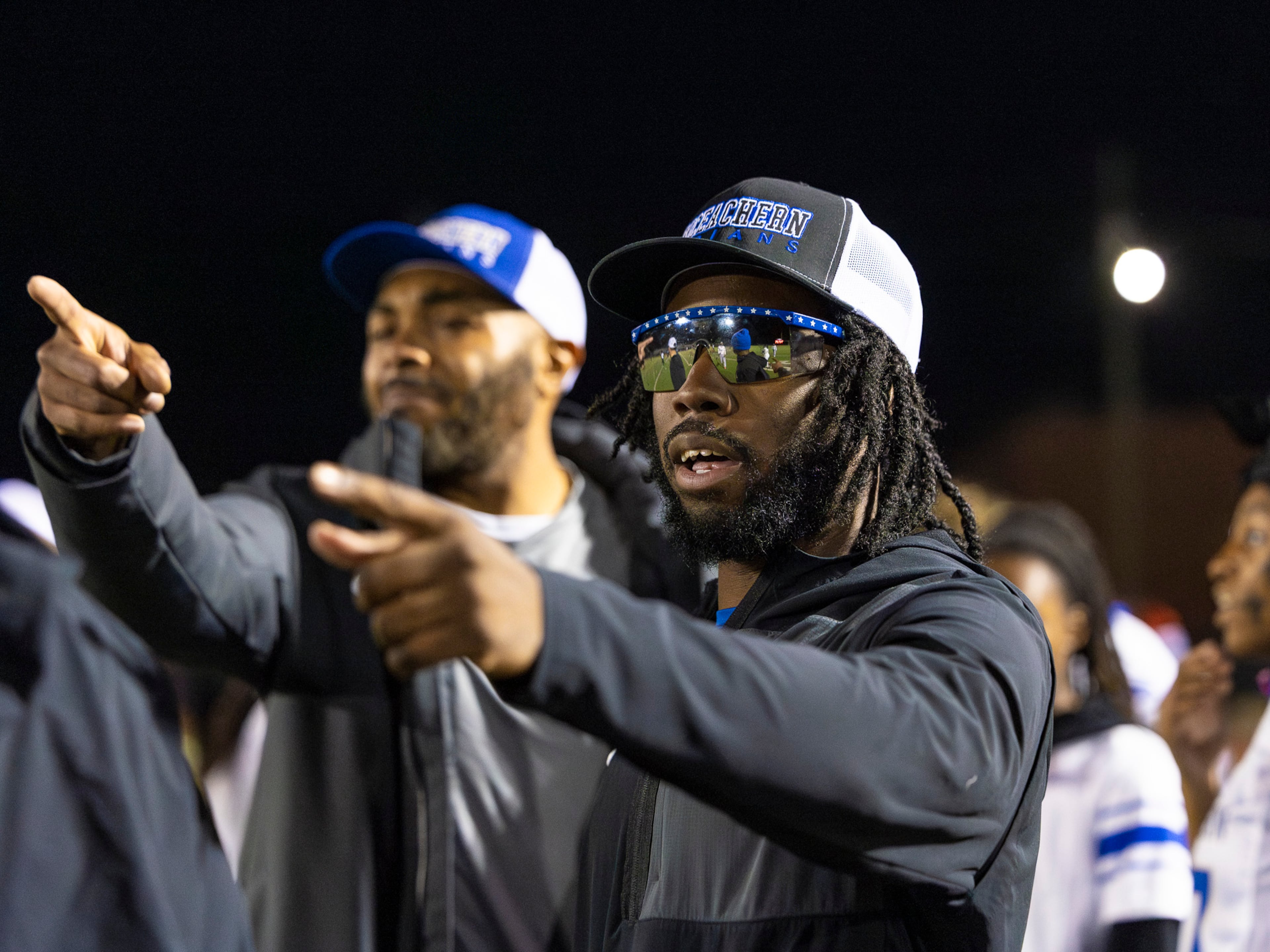 Nigel Talton (right) helped coach the McEachern High School flag football team to a win on Monday, Nov. 17, 2025. (Oscar Guevara Saenz for the AJC)