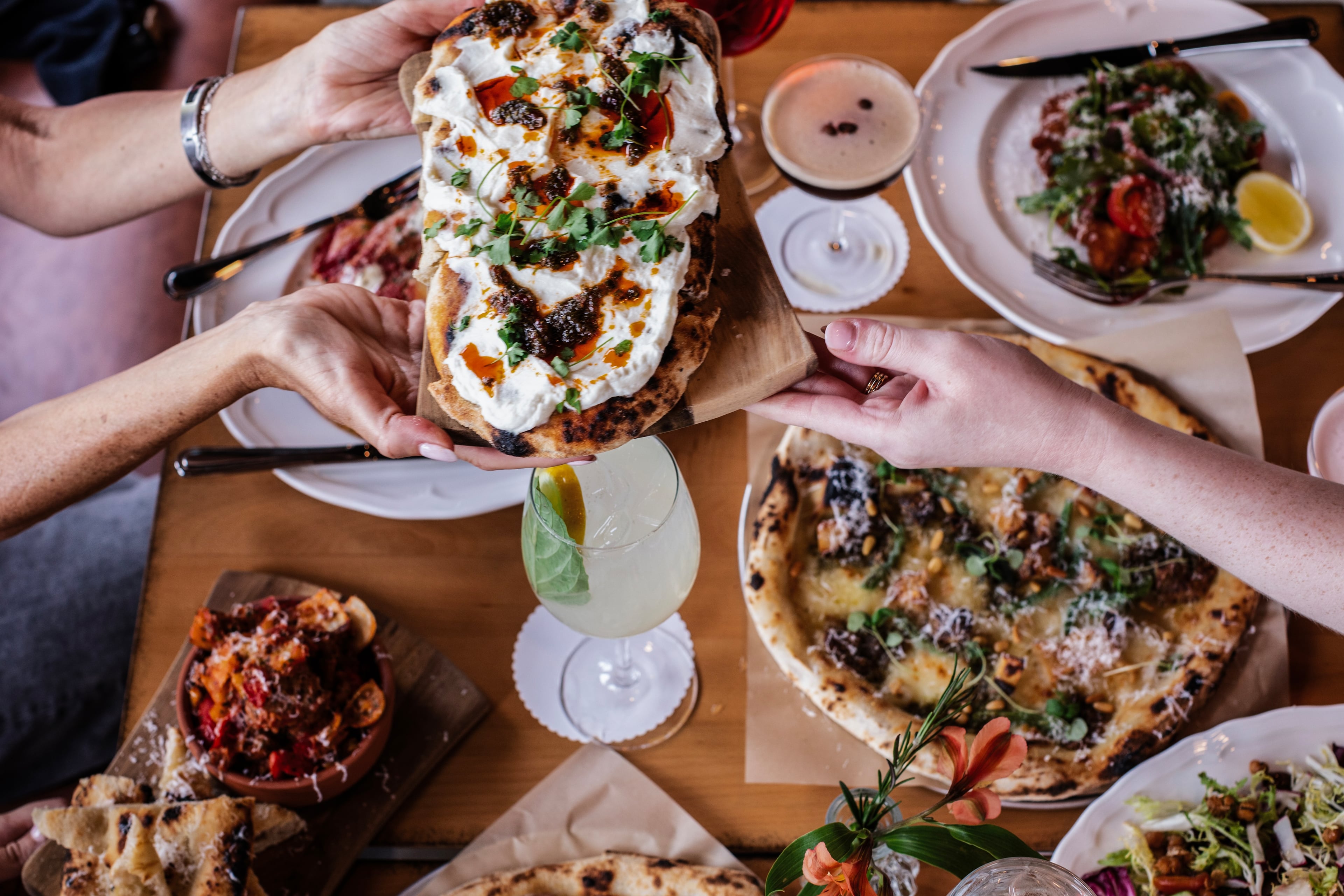 A variety of food items at Bicicletta, which makes very good pizza based on a 72-hour fermented pizza dough. (Courtesy of Bicicletta)