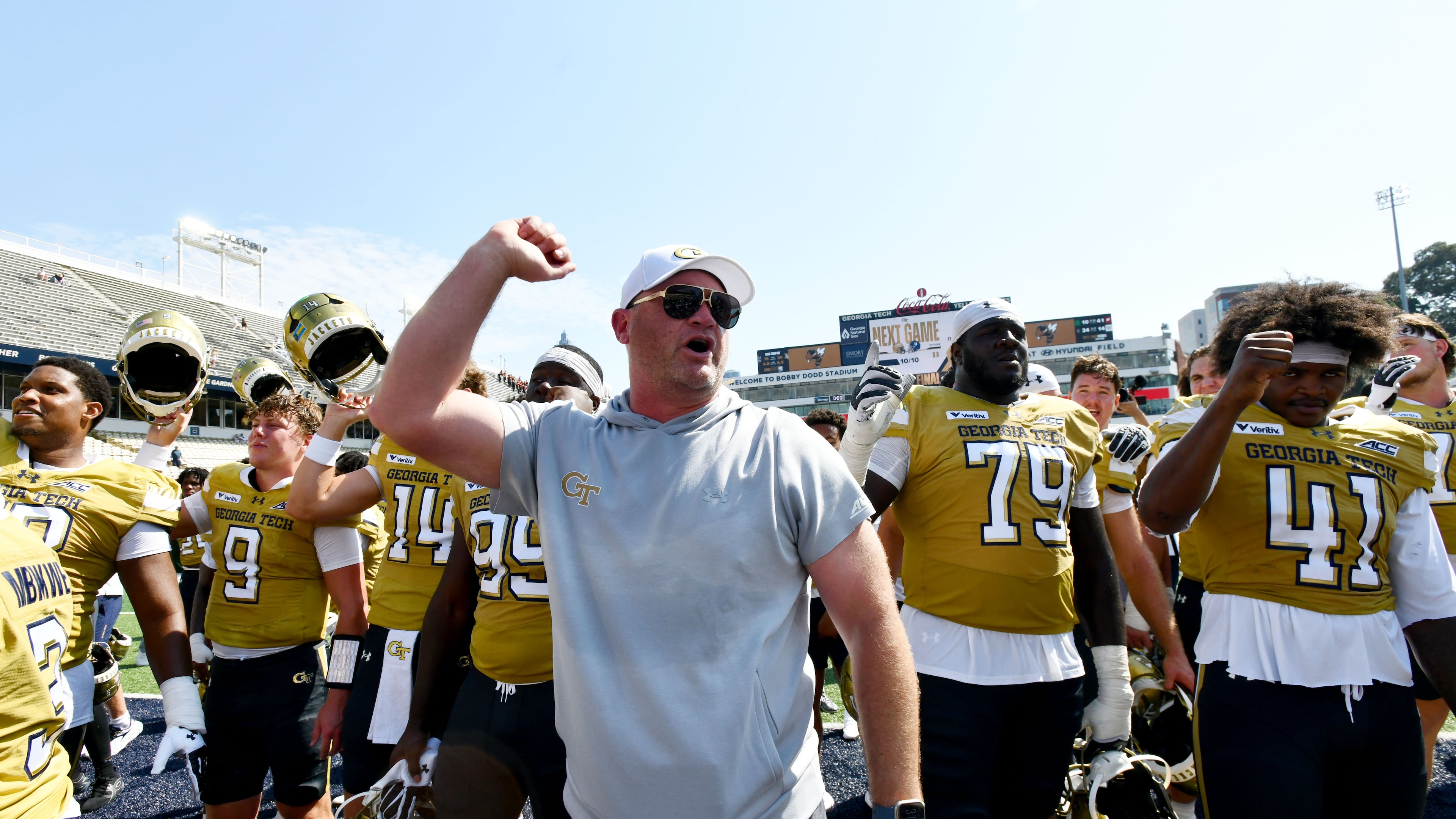Georgia Tech head coach Brent Key and players celebrate after Georgia Tech defeated Mercer during the second half of an NCAA college football game at Bobby Dodd Stadium on Saturday, Sept. 19, 2026, in Atlanta. Georgia Tech defeated Mercer 44-11. (Hyosub Shin/AJC)
