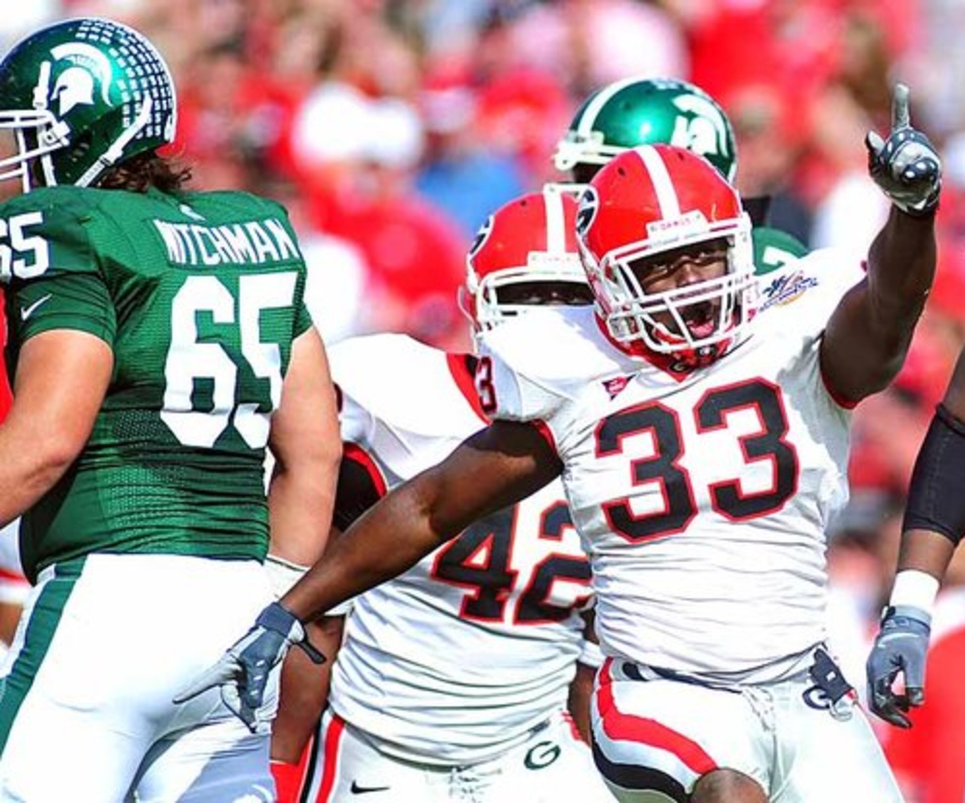 Georgia linebacker Dannell Ellerbe (33) celebrates a tackle in the first half.