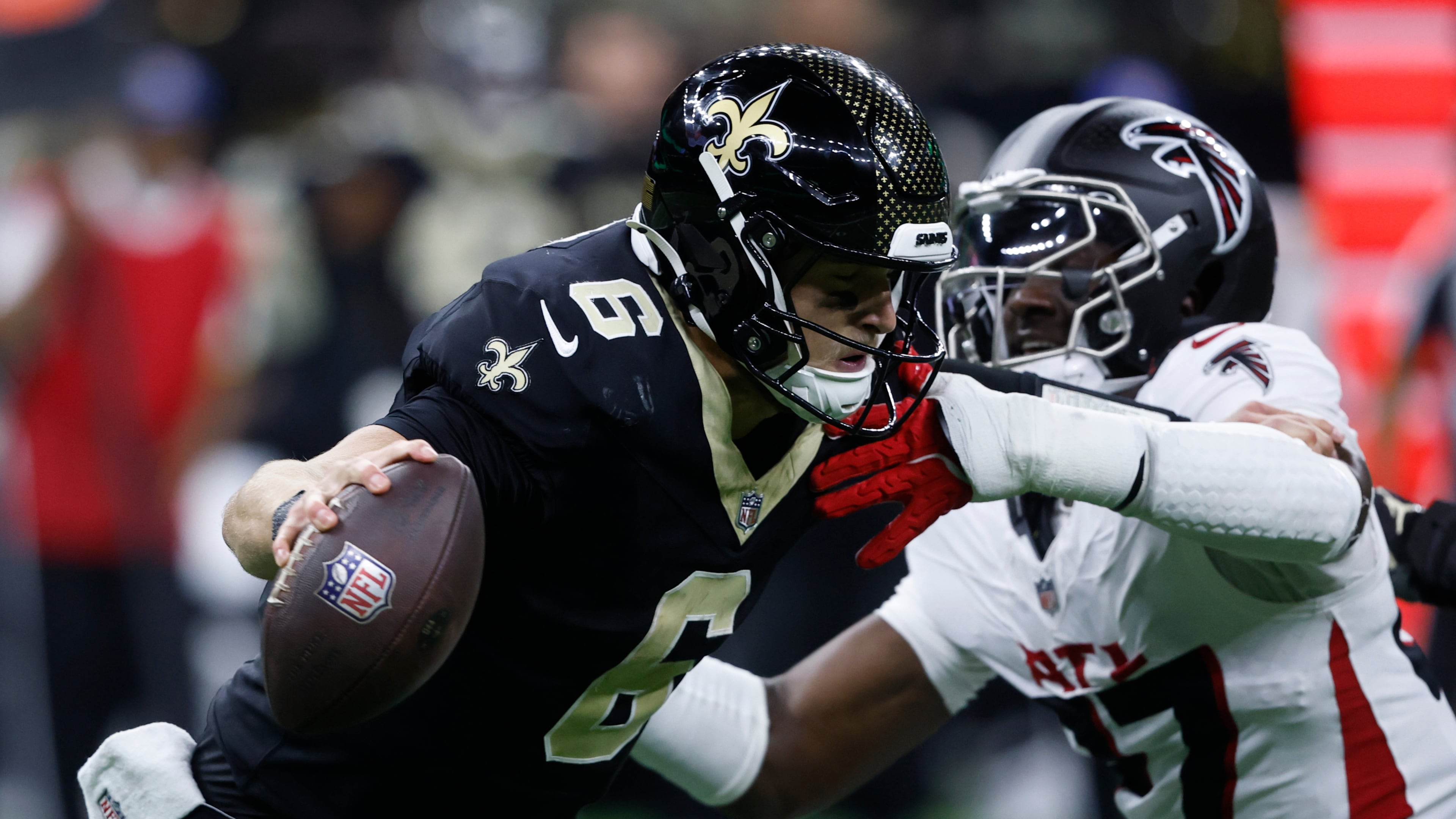 New Orleans Saints quarterback Tyler Shough (6) is sacked by Atlanta Falcons linebacker James Pearce Jr. in the second half of an NFL football game, Sunday, Nov. 23, 2025, in New Orleans. (AP Photo/Butch Dill)