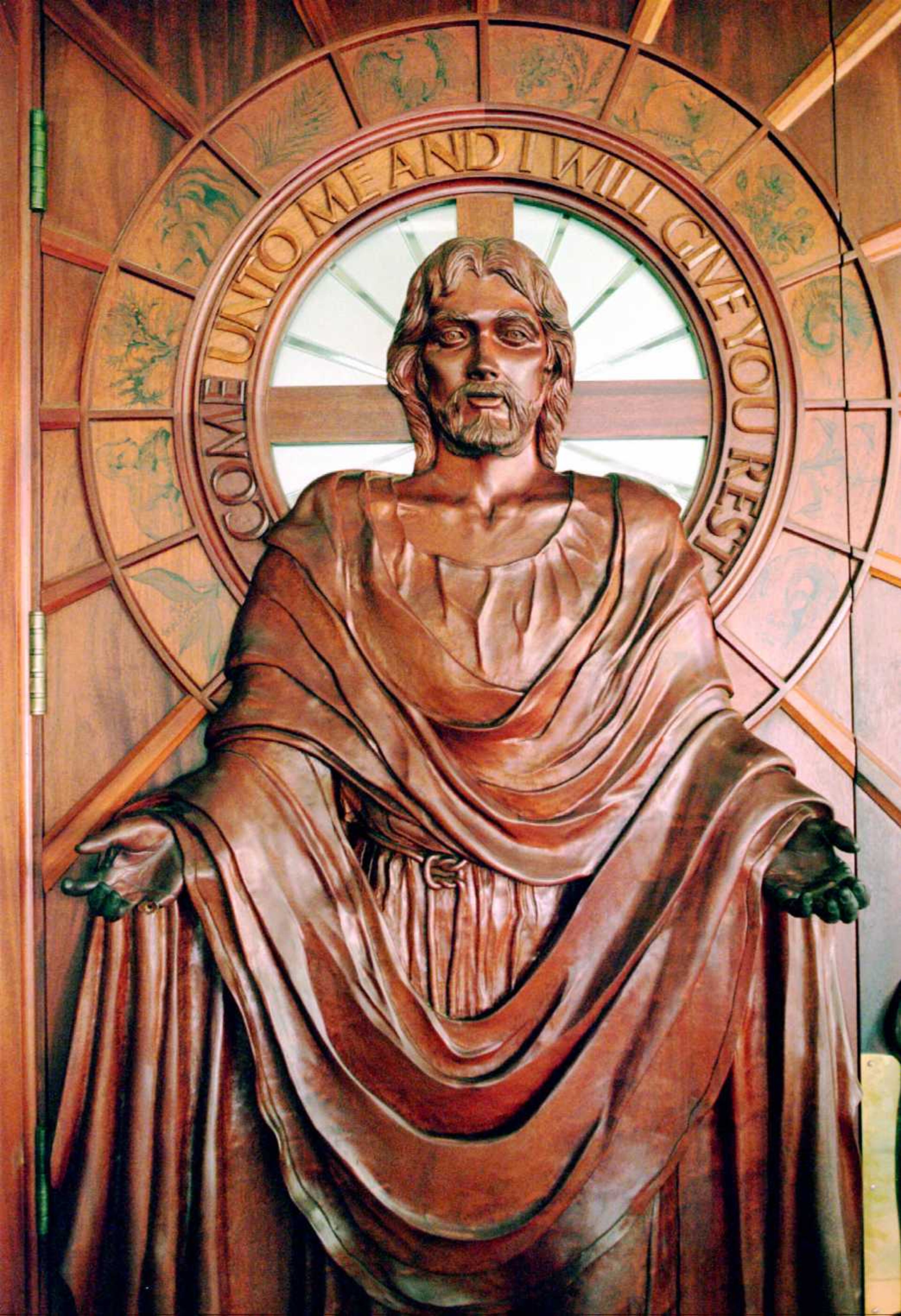 A hand carved wooden Jesus door graces the front of the Simpsonwood Conference Retreat Center. (Copy)