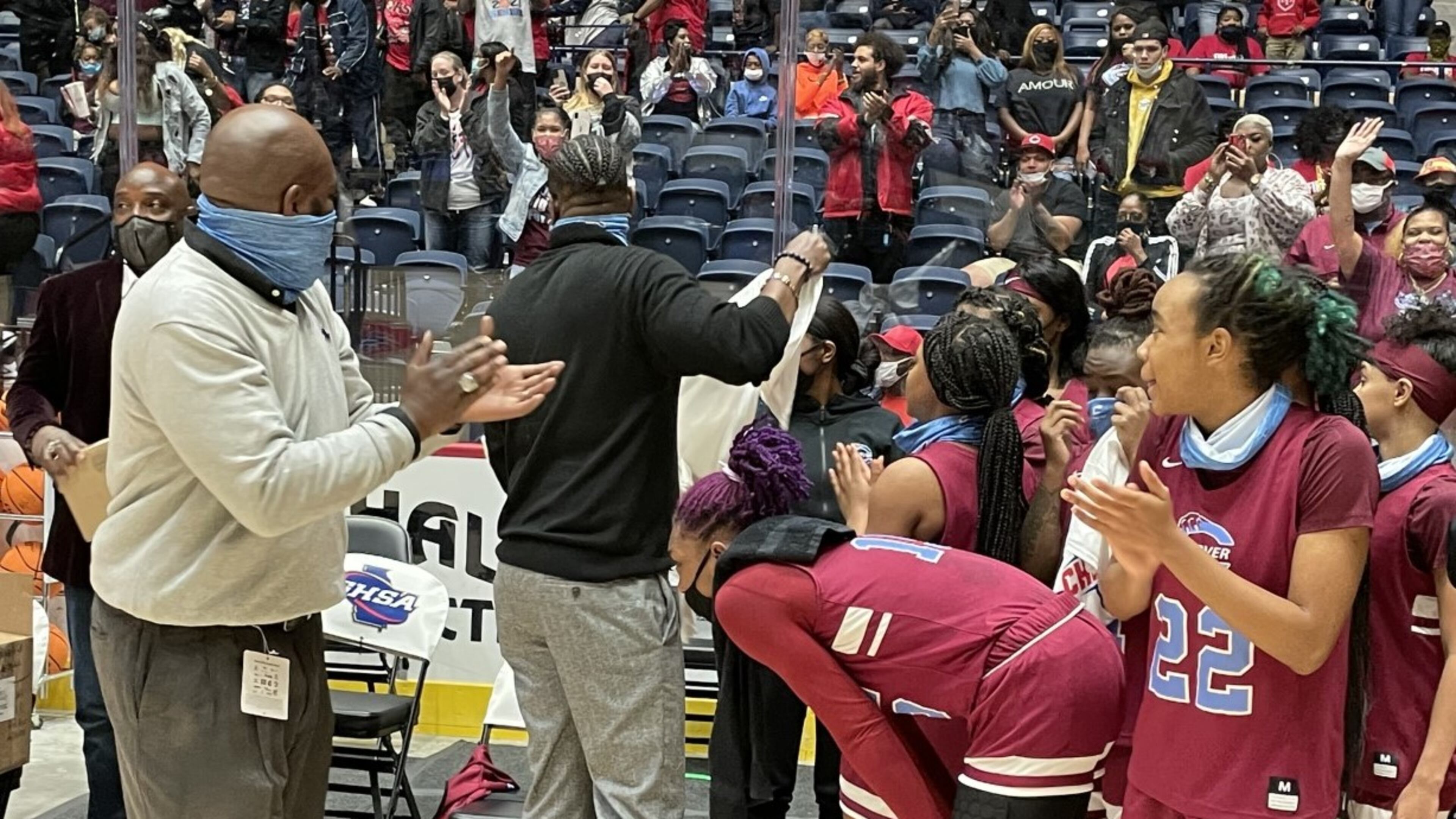 Carver-Columbus coach Anson Hundley (left) applauds his team's effort after the Tigers defeated Cairo 70-54 in the Class 4A championship game Wednesday, March 10, 2021, at the Macon Coliseum.