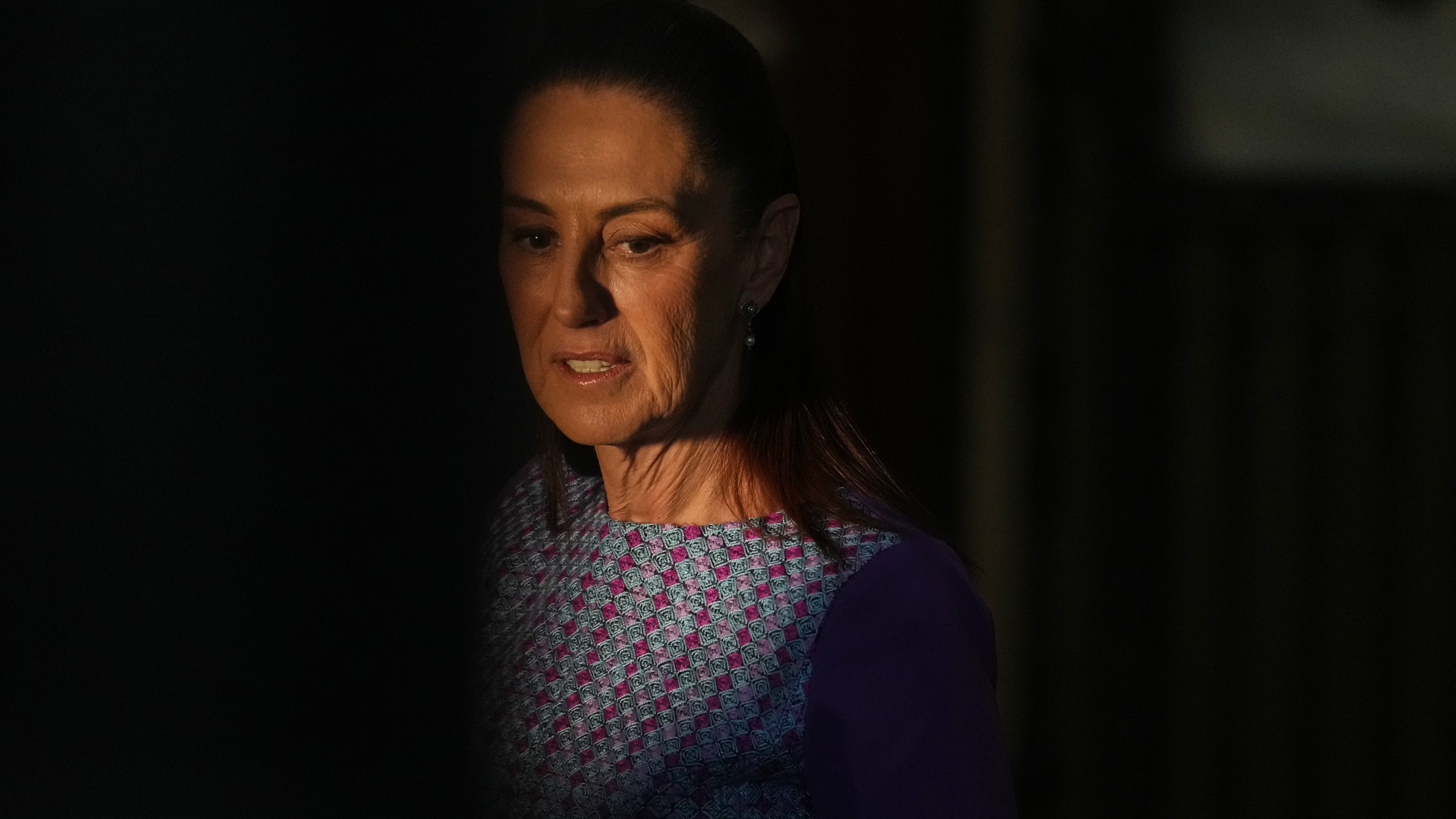 Mexican President Claudia Sheinbaum arrives at the National Palace to give her daily morning press conference in Mexico City, Thursday, April 30, 2026. (AP Photo/Fernando Llano)