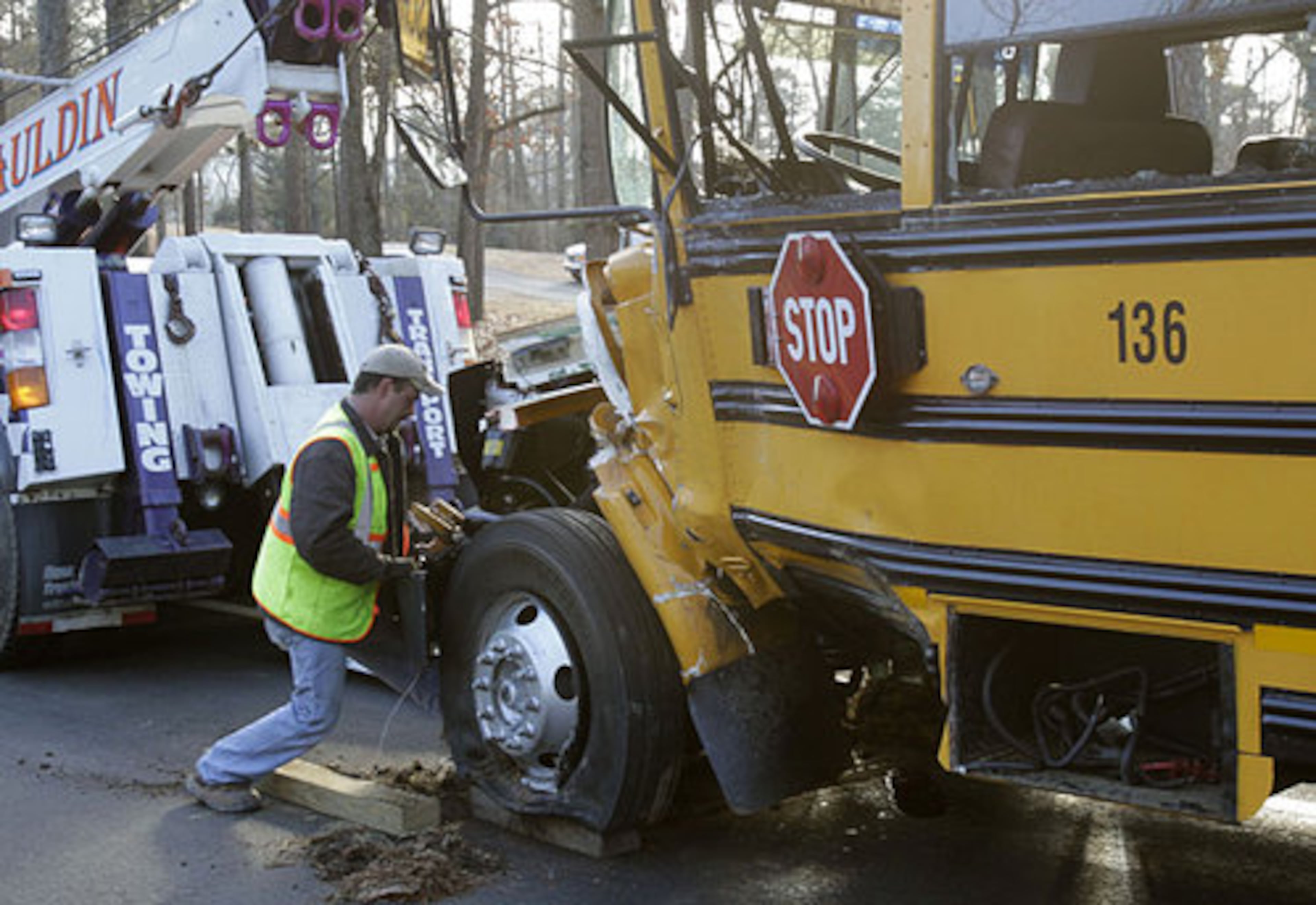 The front of the bus had pieces missing from the crash.