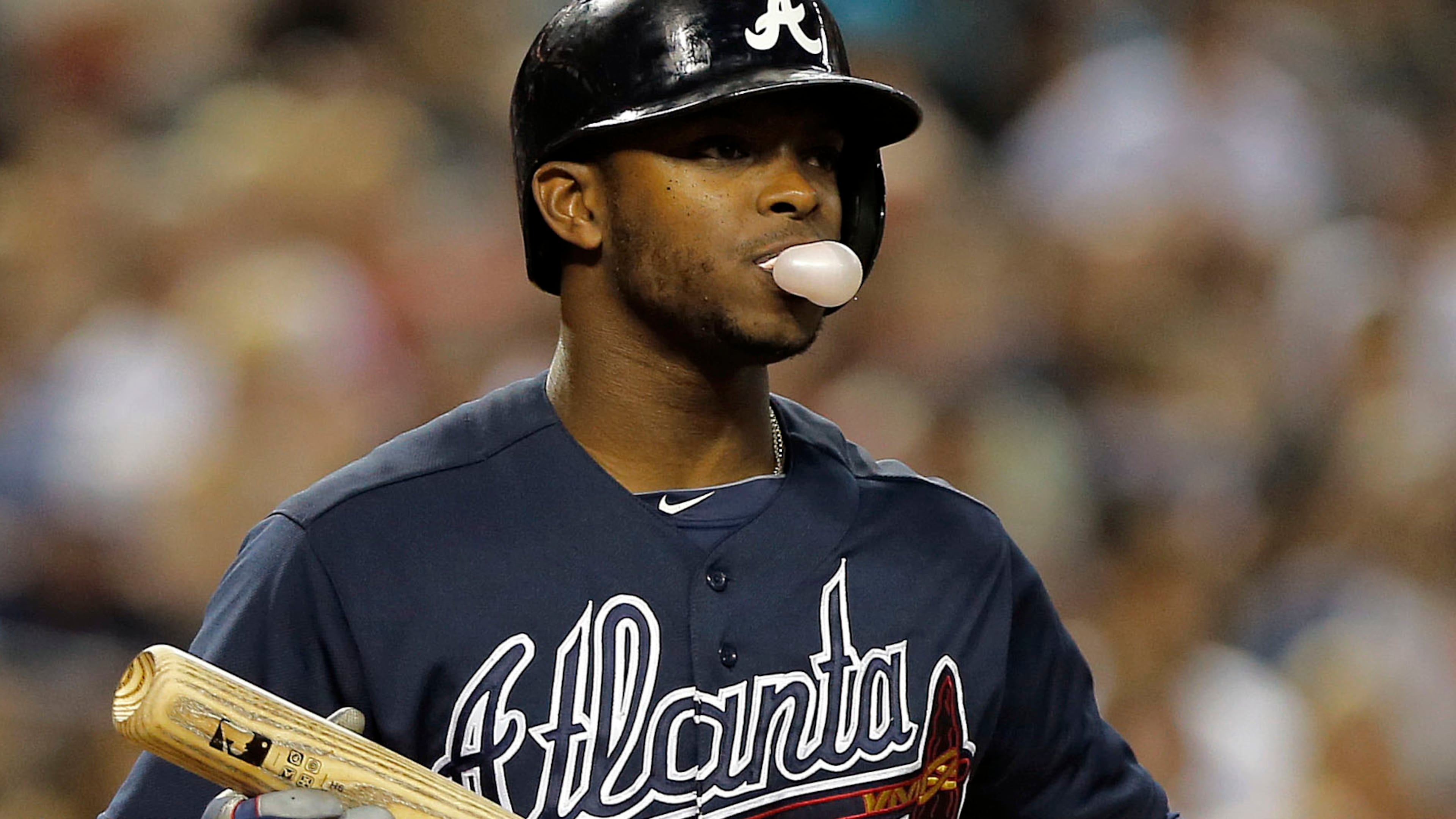Atlanta Braves' Justin Upton walks to the dugout after striking out against the Arizona Diamondbacks during the eighth inning of a baseball game, Tuesday, May 14, 2013, in Phoenix. (AP Photo/Matt York)