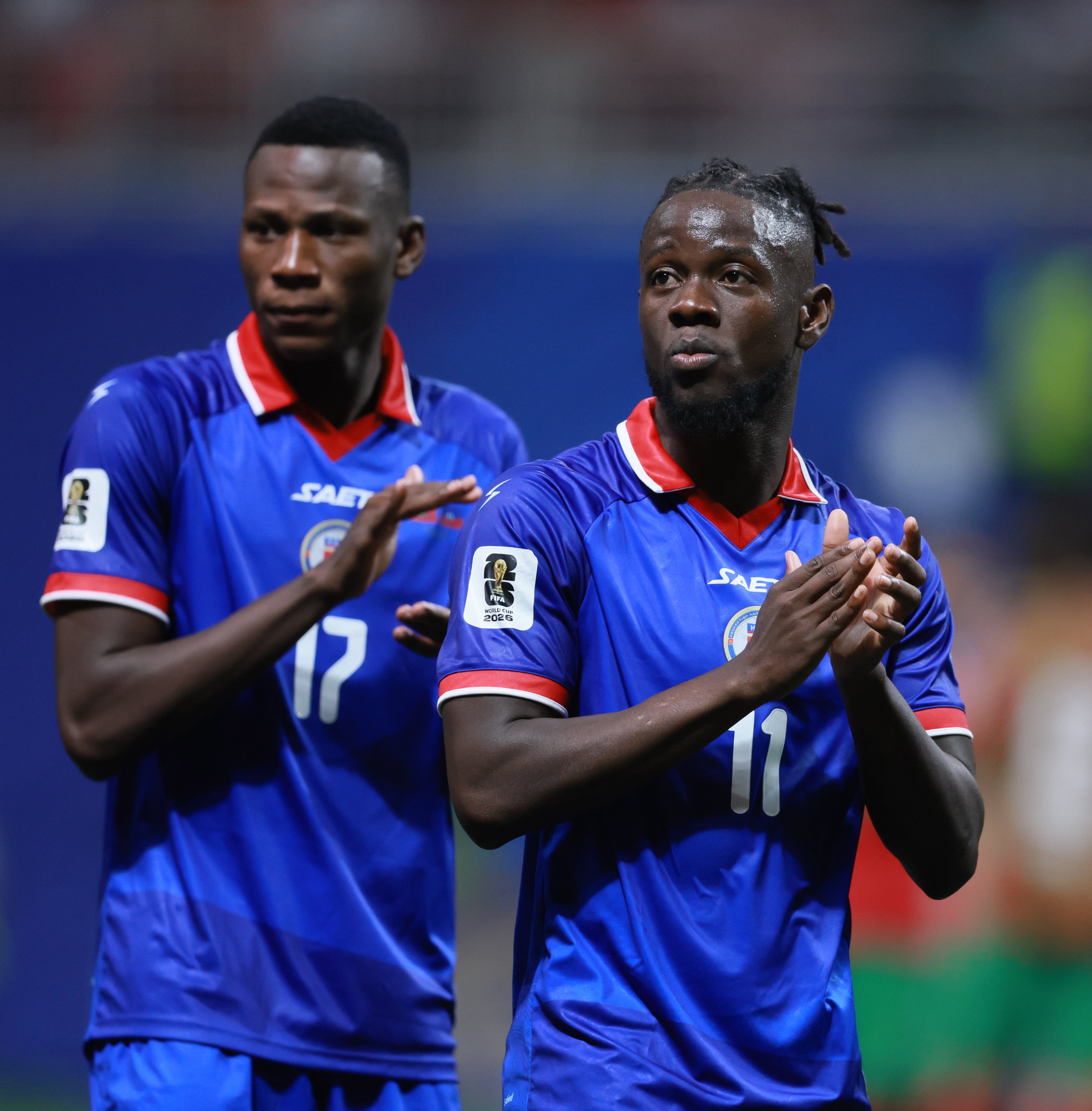 Haiti's Louicius Deedson, right, and teammate Danley Jean Jacques appplaud following their loss against Morocco in Group C FIFA World Cup match at Atlanta Stadium (Mercedes-Benz Stadium) on Wednesday, June 24, 2026. (Jason Getz/AJC)