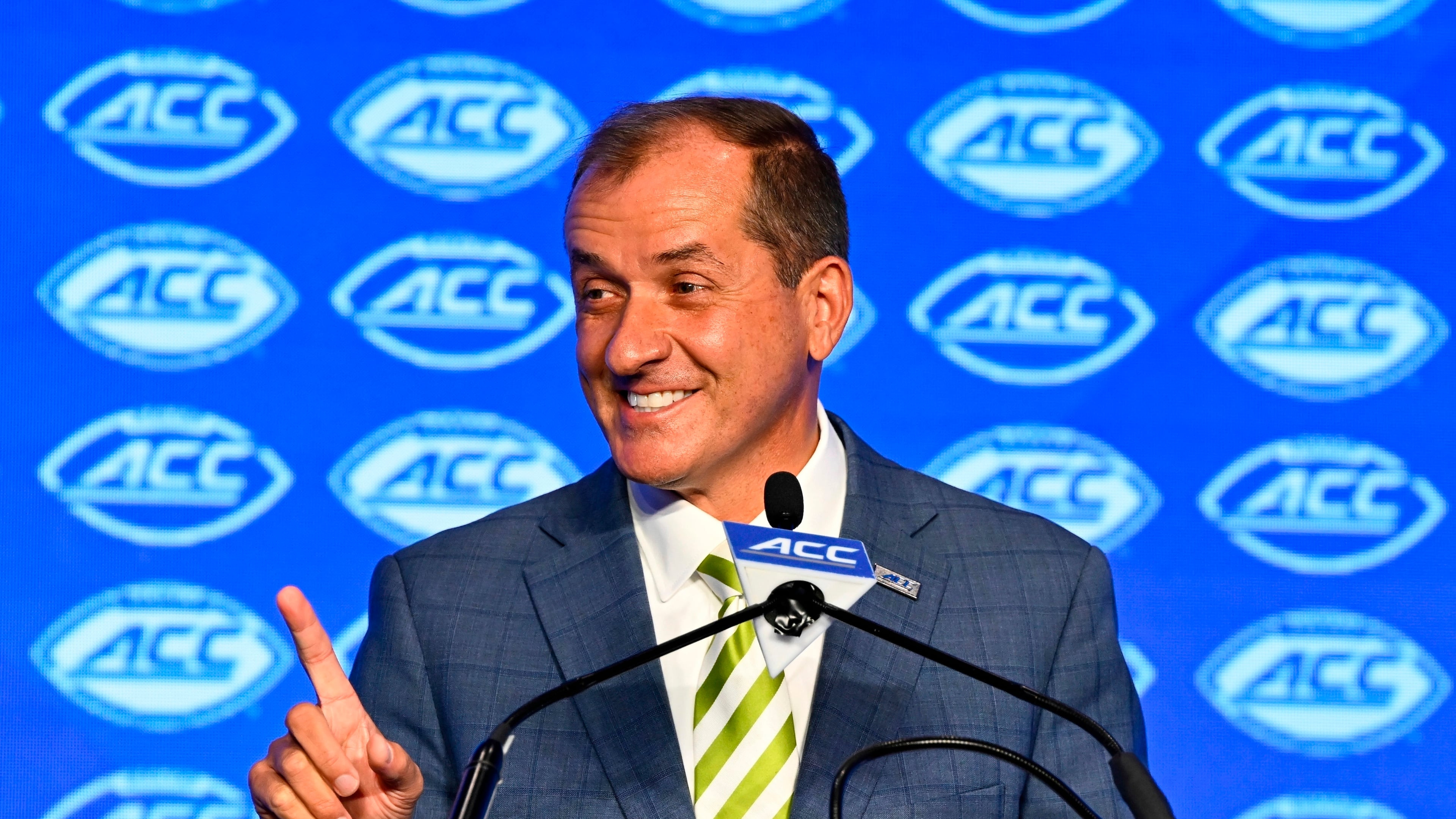 FILE - Atlantic Coast Conference commissioner Jim Phillips smiles during an NCAA college football news conference at the ACC media days, July 22, 2024, in Charlotte, N.C. (AP Photo/Matt Kelley, File)