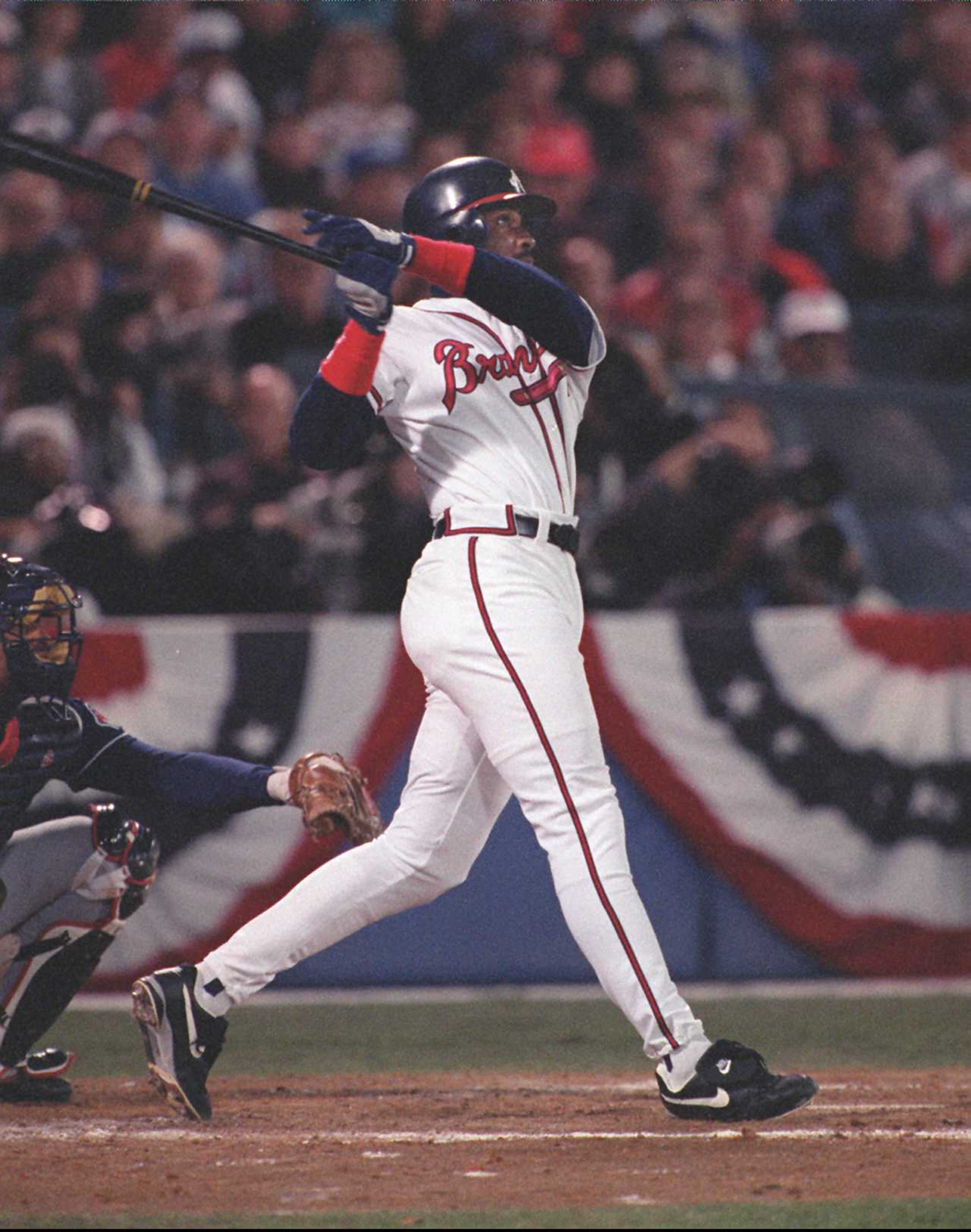 Fred McGriff watches his home run leave the park in the second inning.