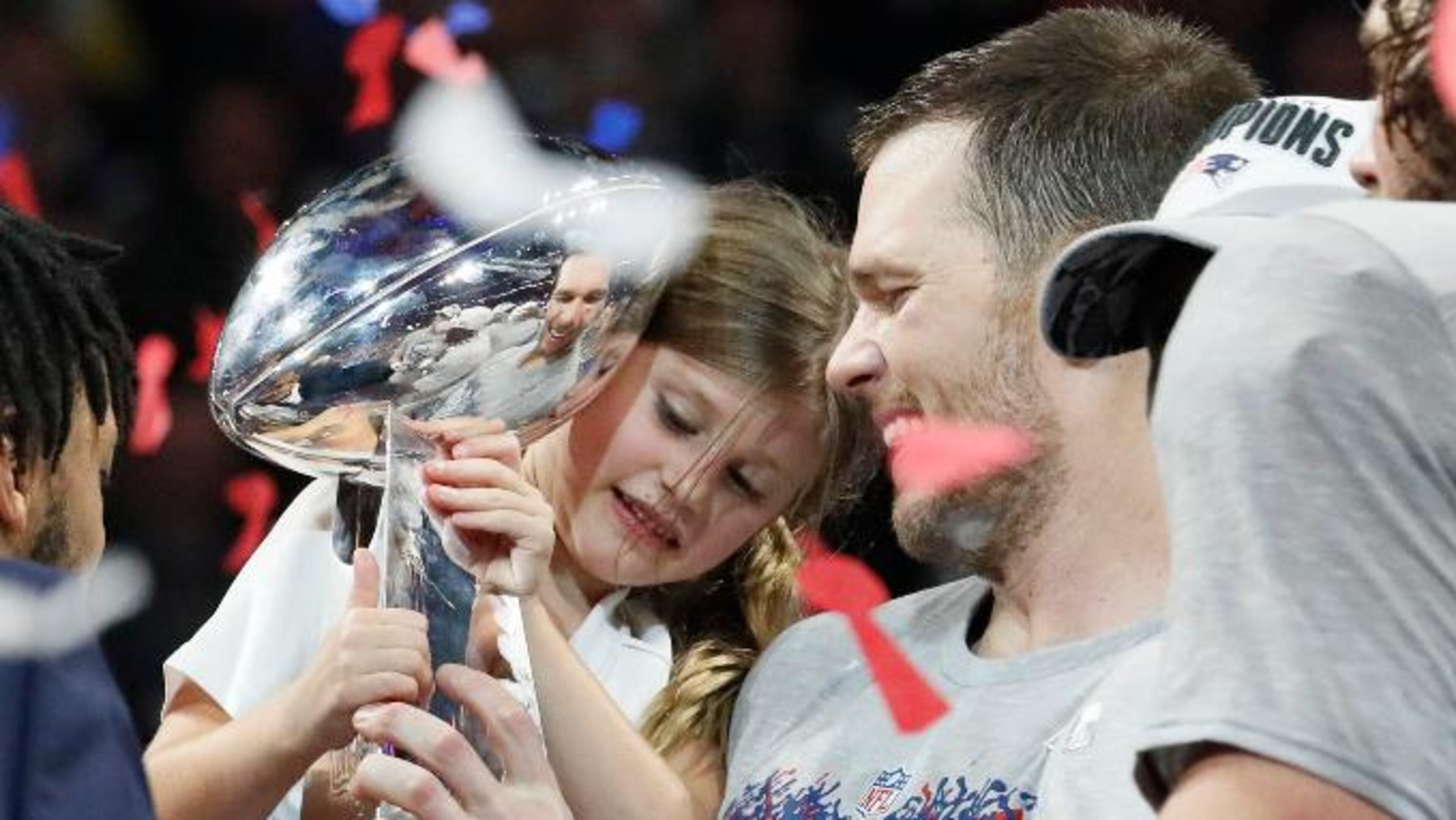 New England Patriots quarterback Tom Brady shares a moment with daughter Vivian Lake Brady after winning his sixth Super Bowl, 13-3, against the Los Angeles Rams in Super Bowl LIII at Mercedes-Benz Stadium in Atlanta, Ga. on Sunday, Feb. 3, 2019. Bob Andres / bandres@ajc.com