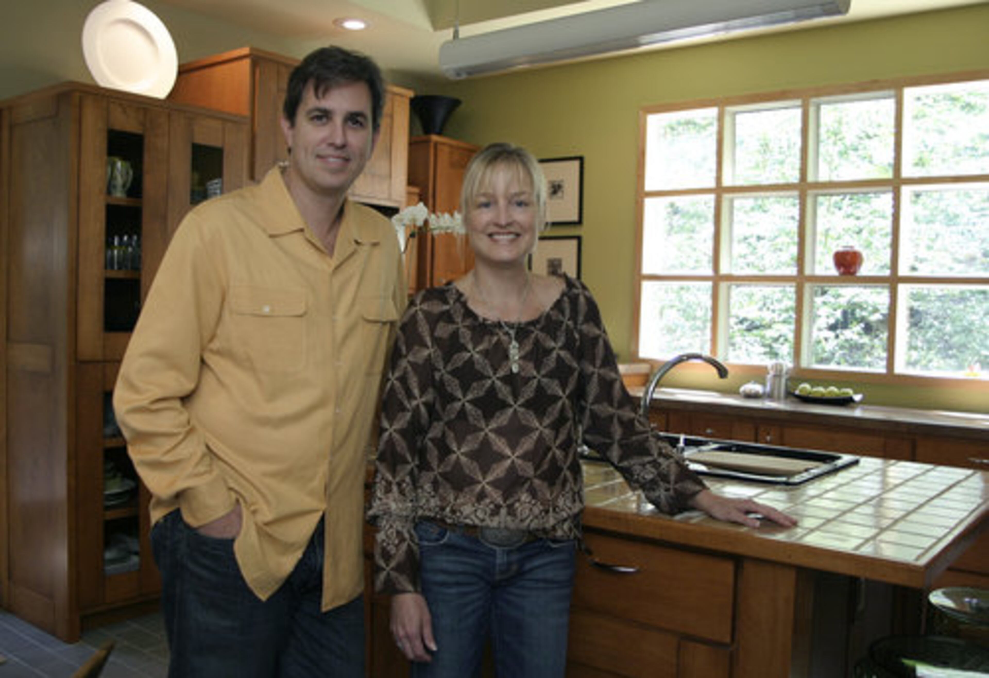Seclusion and a sense of nature is what led Scott and Kim Mills to the community of Mountain Park when they built their home eight years ago. The kitchen is the heart of the home and draws the family together. There's a television, and their 14-year-old son Tyler often does his homework there. Scott Mills also brings his laptop into the room.