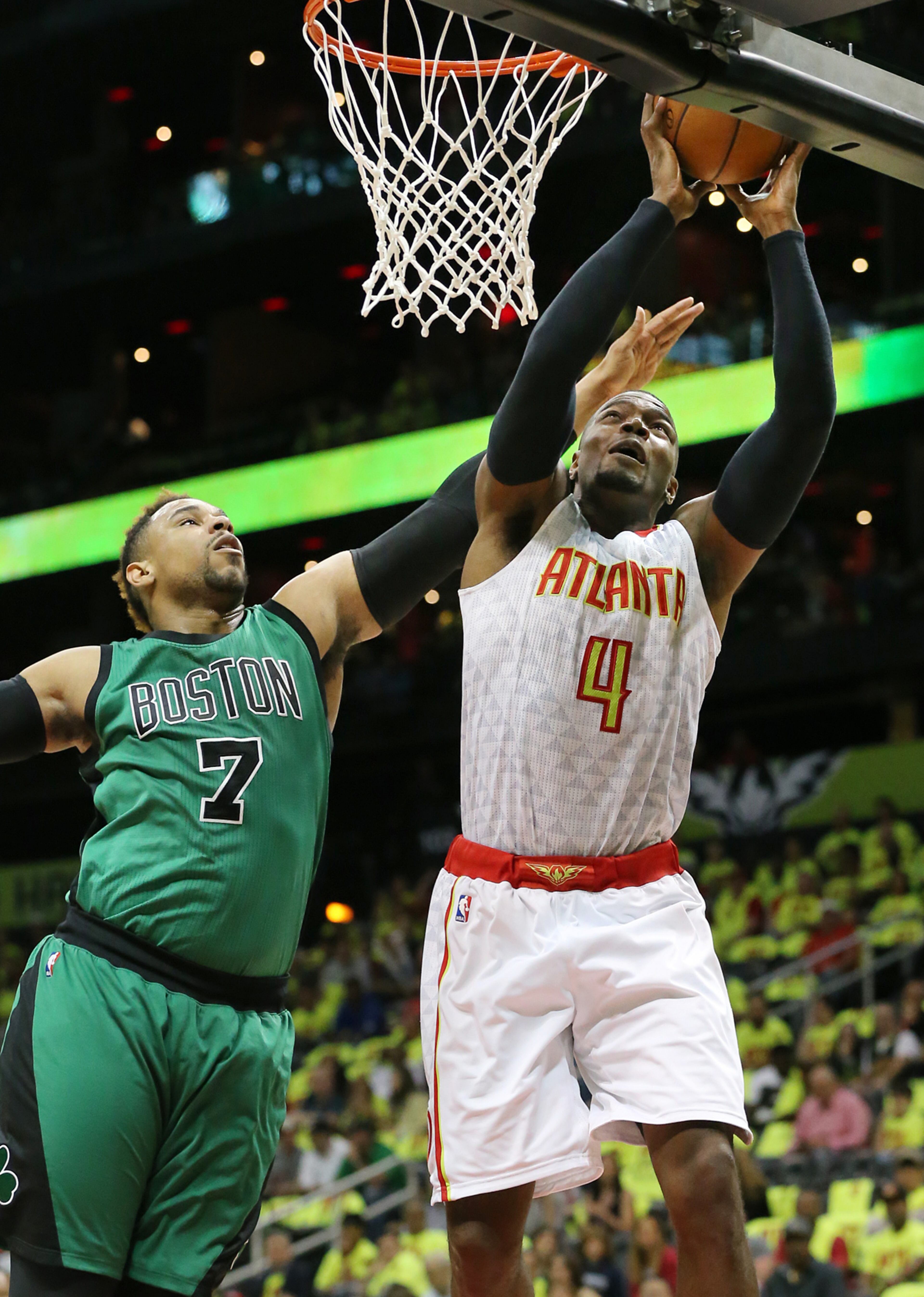 041616 ATLANTA: Hawks Paul Millsap gets past Celtics Jared Sullinger for two points in their NBA Eastern Conference first round playoff game at Philips Arena on Saturday, April 16, 2016. Curtis Compton / ccompton@ajc.com