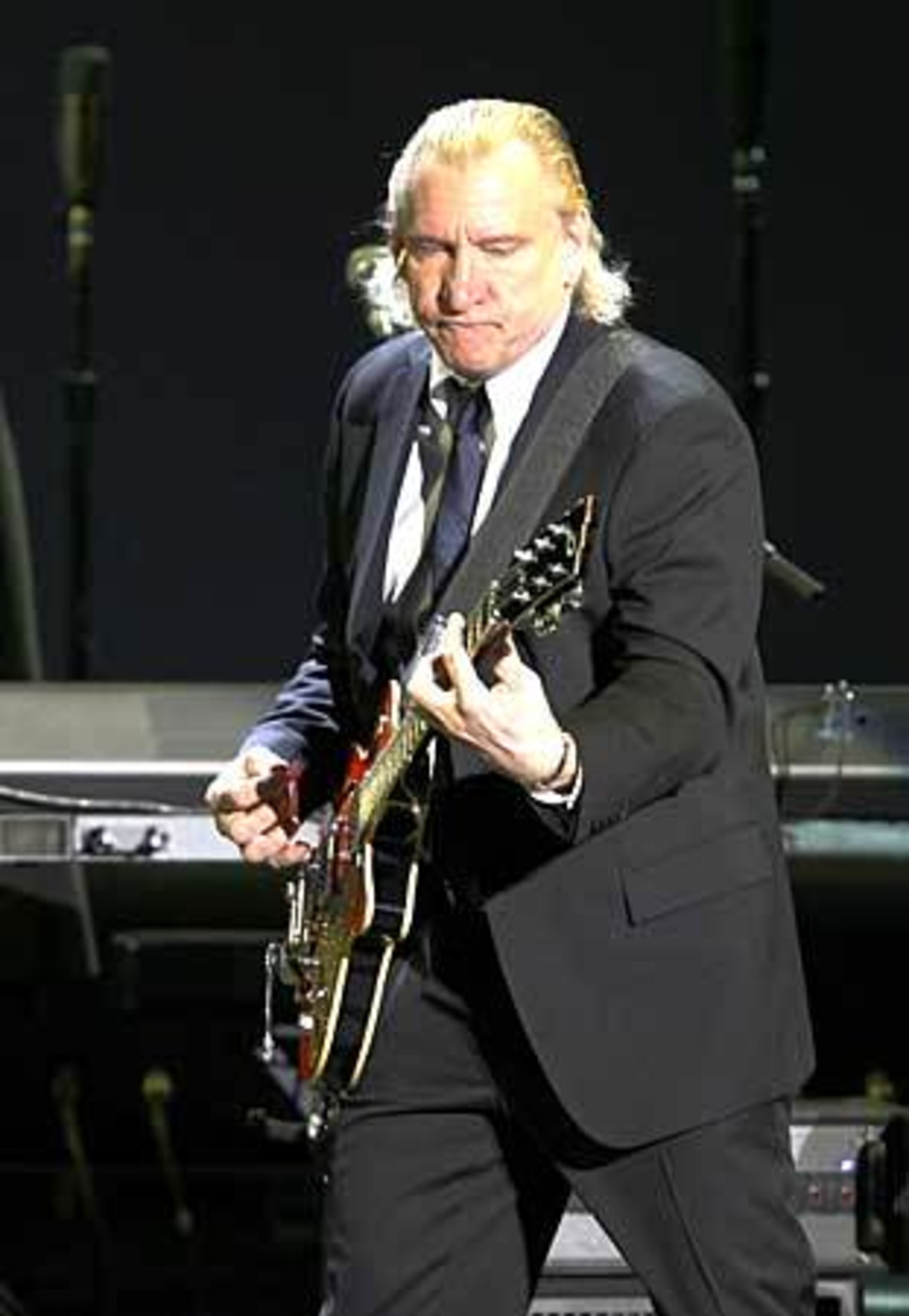 Guitarist Joe Walsh had a highly successful solo career in the 1970s. He joined the Eagles in 1976, replacing Bernie Leadon. He returned to a solo career in the '80s, with mixed results, and was a driving force behind the Eagles reunion in 1994.
