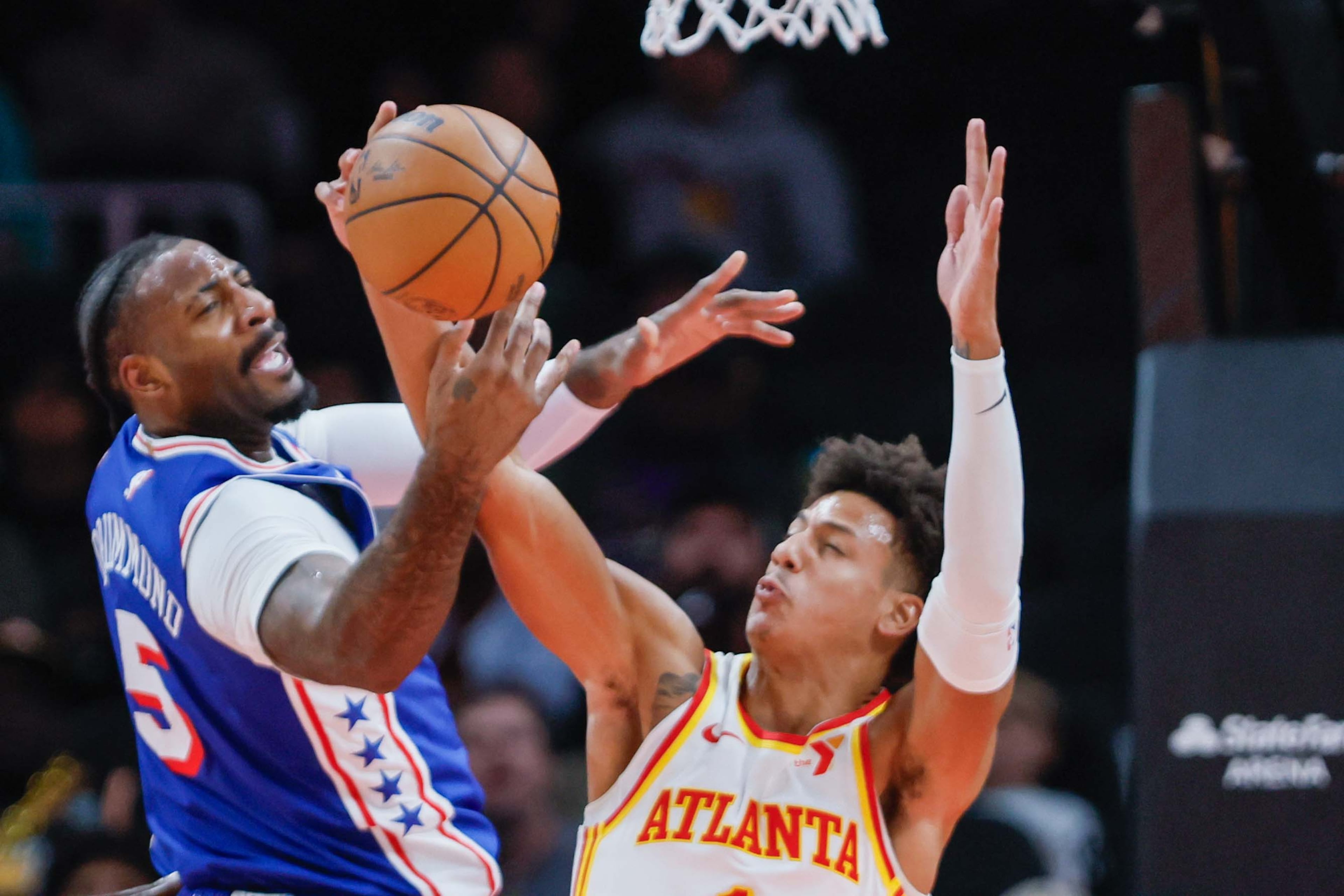 Atlanta Hawks forward Jalen Johnson (1) fights for a rebound against Philadelphia 76ers center Andre Drummond (5) during the second half at State Farm Arena during an NBA exhibition game on Monday, October 14, 2024, in Atlanta.
(Miguel Martinez/ AJC)