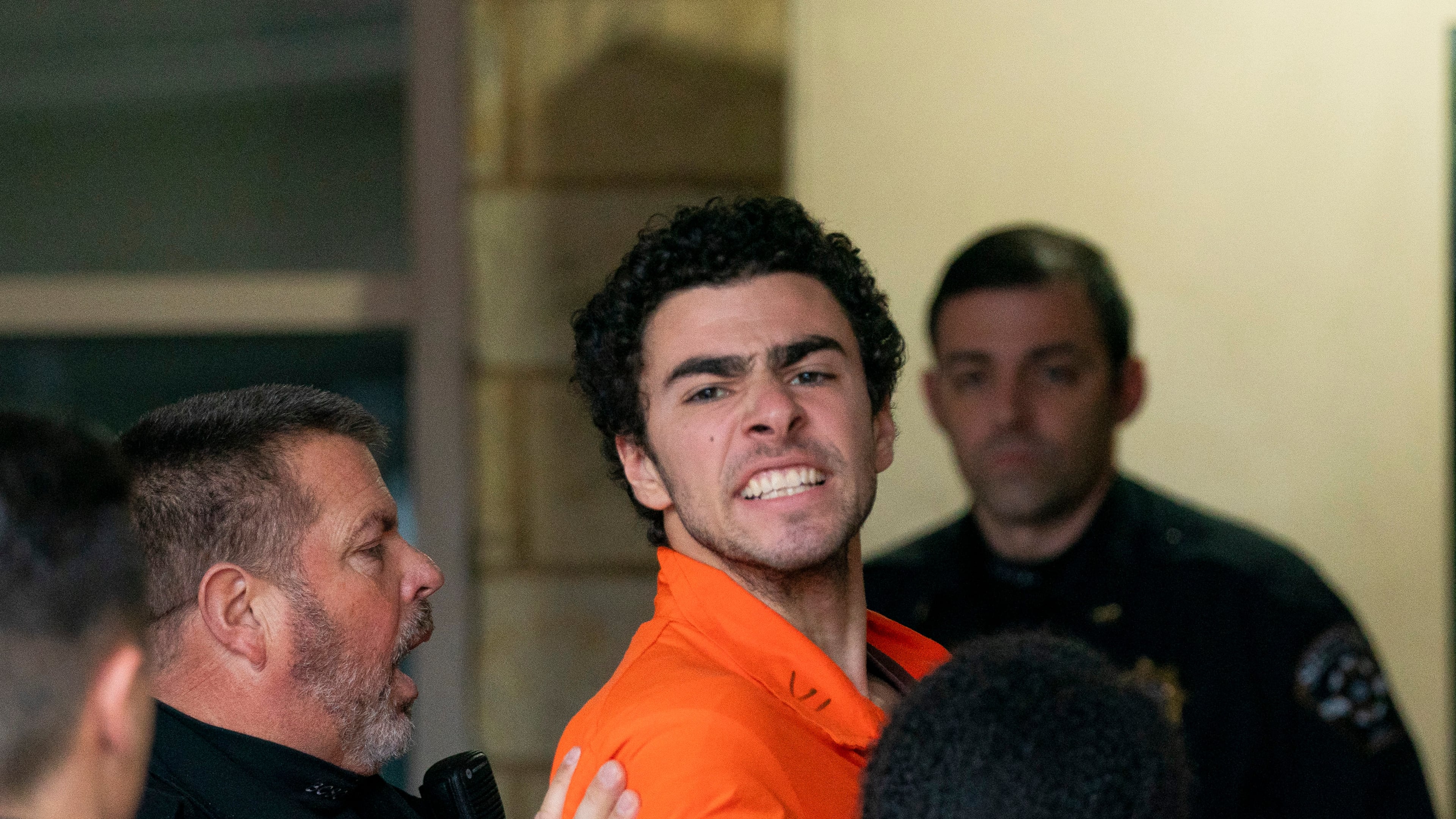 FILE - Suspect Luigi Mangione is taken into the Blair County Courthouse on Tuesday, Dec. 10, 2024, in Hollidaysburg, Pa. (Benjamin B. Braun/Pittsburgh Post-Gazette via AP, File)