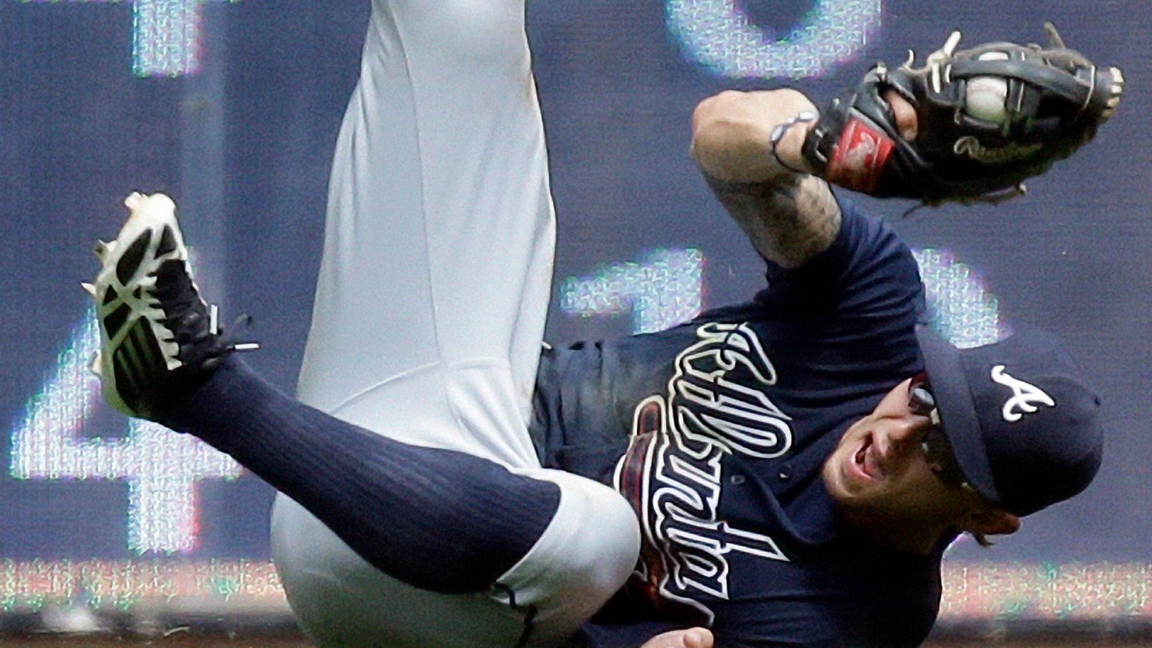 Atlanta Braves' Jordan Schafer makes a diving catch on a ball hit by Milwaukee Brewers' Jeff Bianchi during the sixth inning of a baseball game on Sunday, June 23, 2013.