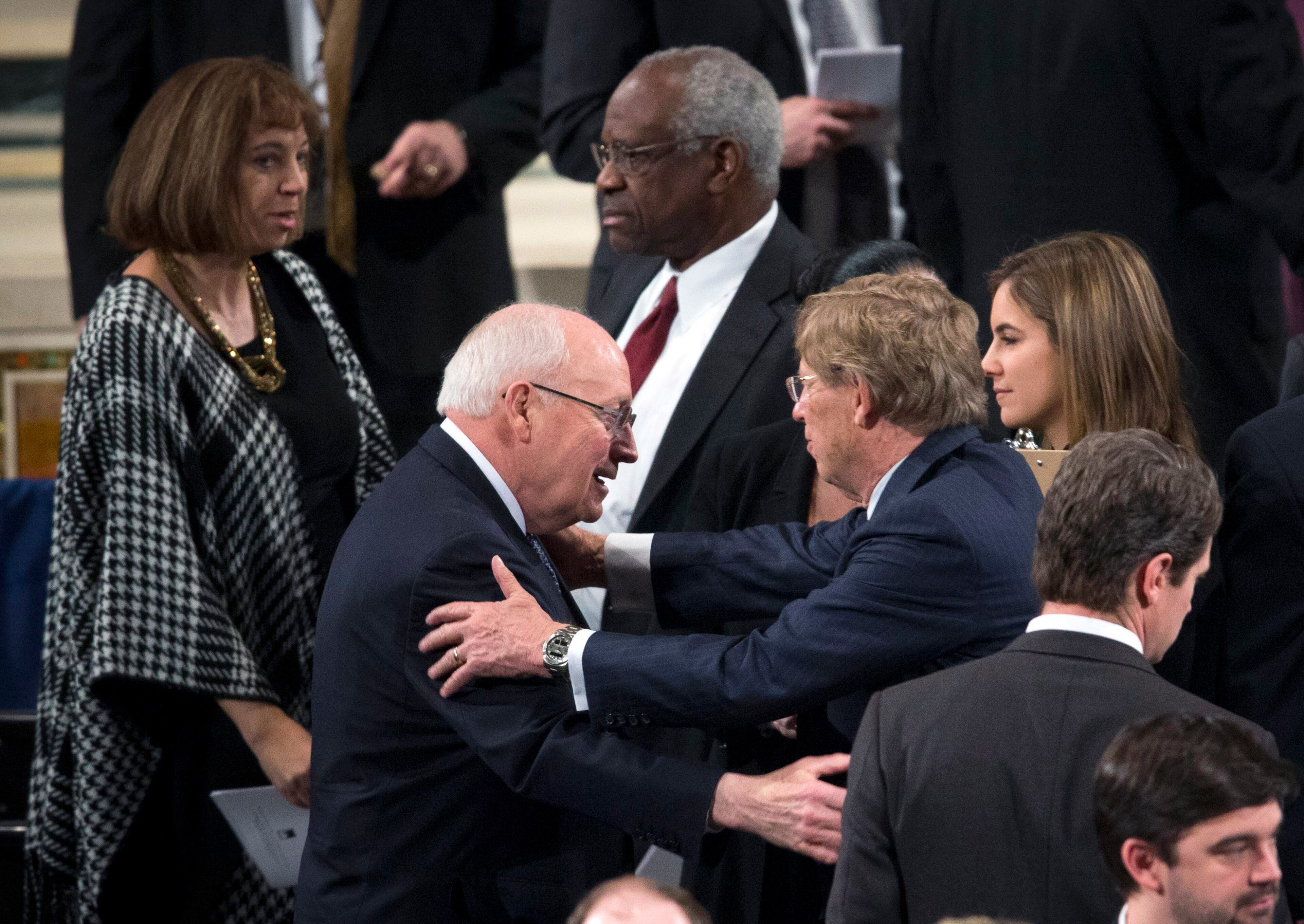 WASHINGTON, DC - FEBRUARY 20: Former Vice President Dick Cheney, left, and Supreme Court Justice Clarence Thomas take their seats for funeral Mass for Associate Justice Antonin Scalia inside the Basilica of the National Shrine of the Immaculate Conception February 20, 2016 in Washington, DC. Scalia, who died February 13 while on a hunting trip in Texas, layed in repose in the Great Hall of the Supreme Court on Friday and his funeral service will be at the basillica today. (Photo by Doug Mills-Pool/Getty Images)