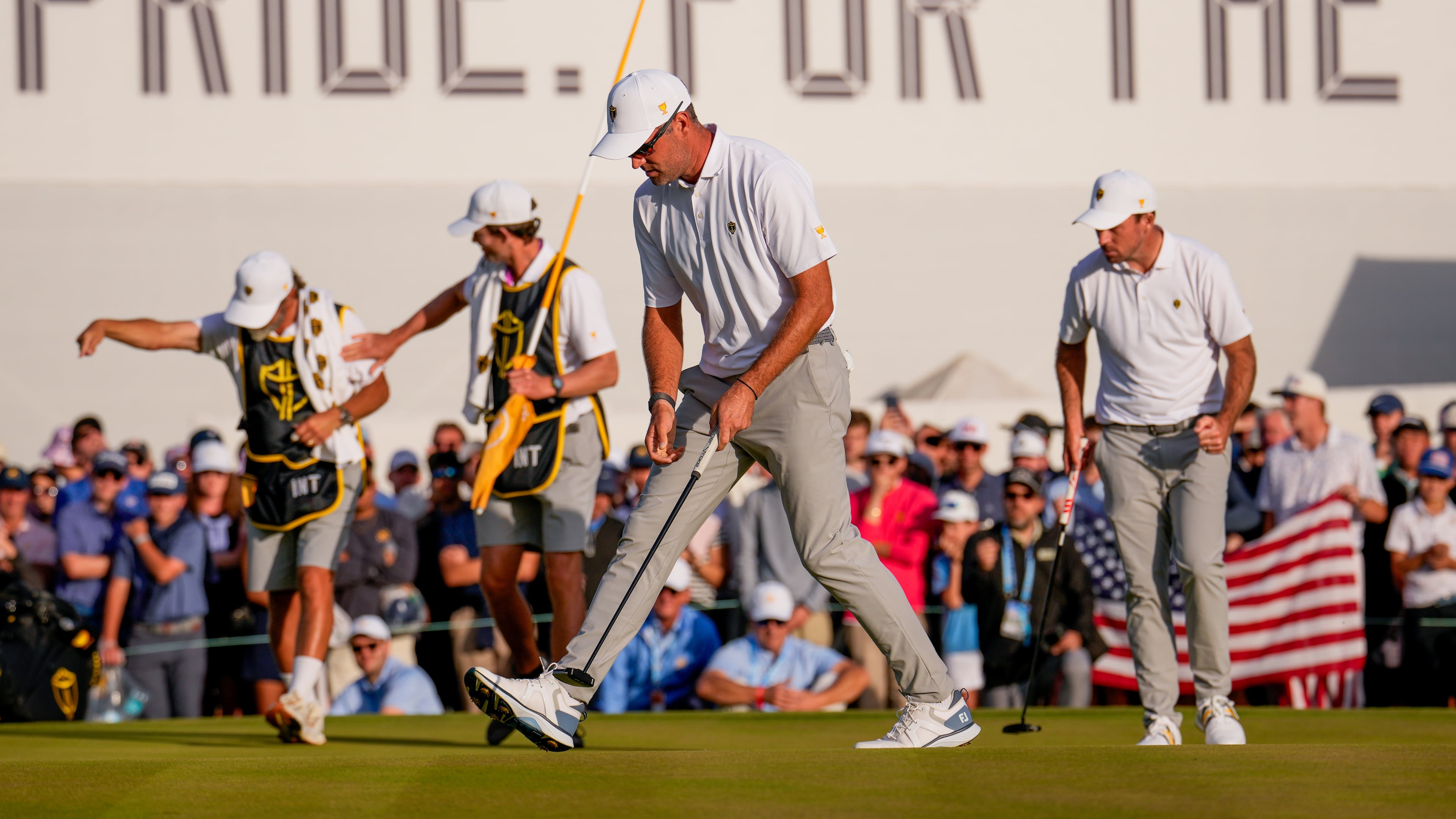 International teams' Corey Conners, of Canada, front, Nick Taylor, of Canada, right, and their caddies celebrate after their Presidents Cup golf tournament third round foursome match against the USA team at Medinah Country Club, Saturday, Sept. 26, 2026, in Medinah, Ill. (AP Photo/Matt Slocum)