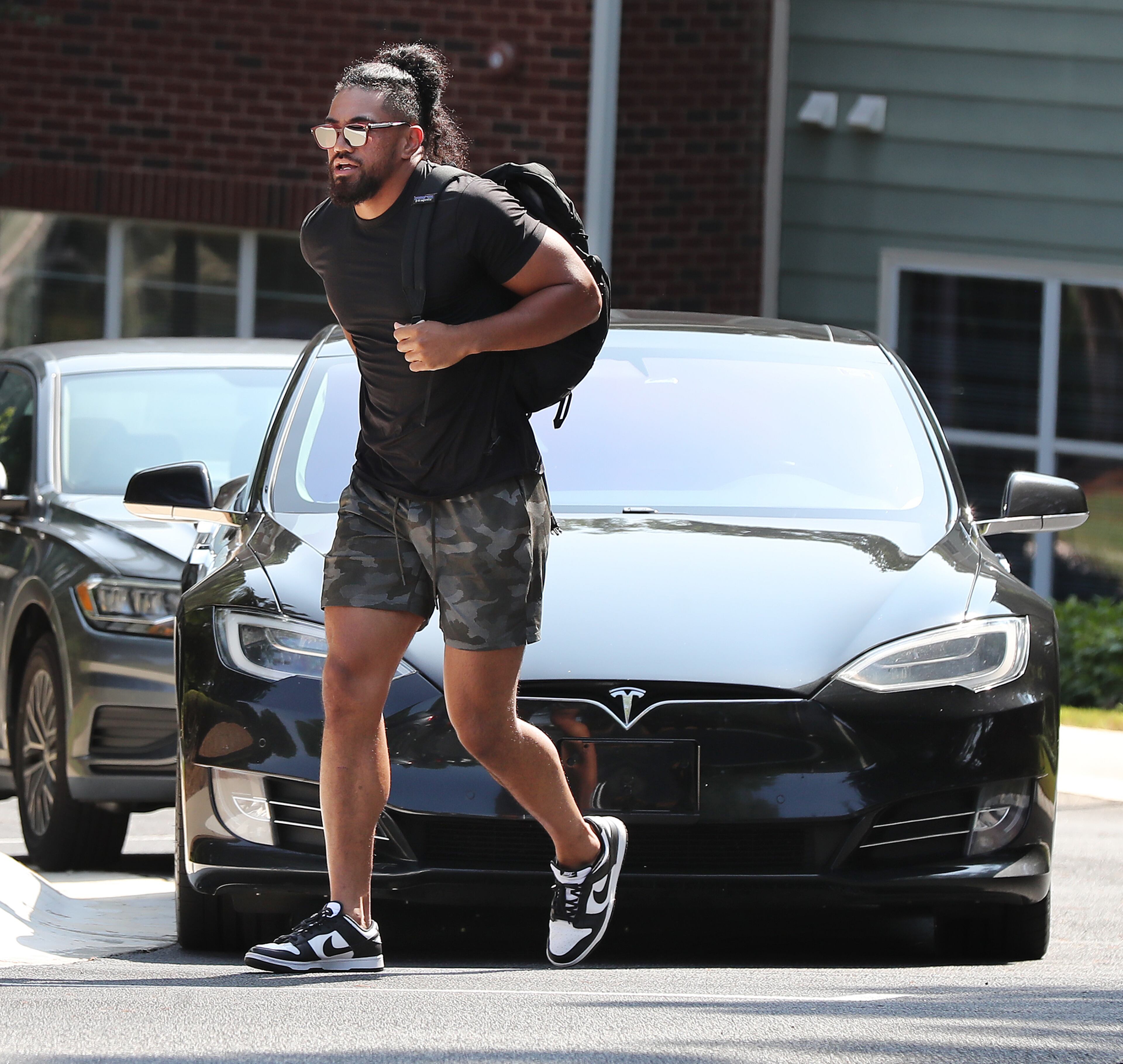 072721 Flowery Branch: Atlanta Falcons linebacker Jacob Tuioti-Mariner arrives in a Tesla for player check in at training camp on report day at the team practice facility on Tuesday, July 27, 2021, in Flowery Branch. “Curtis Compton / Curtis.Compton@ajc.com”