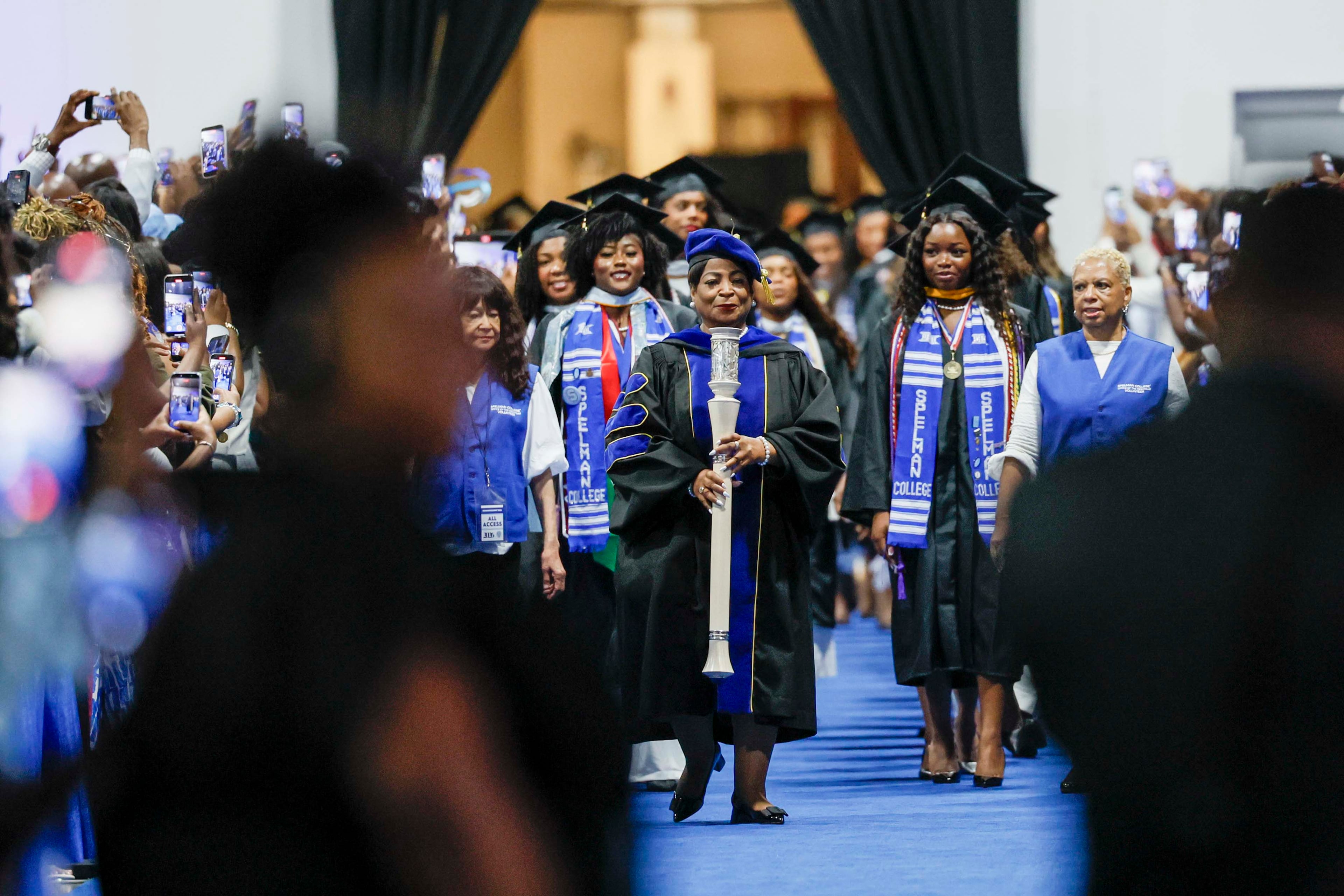 Graduates and staff are seen at the beginning of the procession during the Spelman College Commencement ceremony at the Georgia International Convention Center in College Park on Sunday, May 17, 2026. (Miguel Martinez/AJC)
