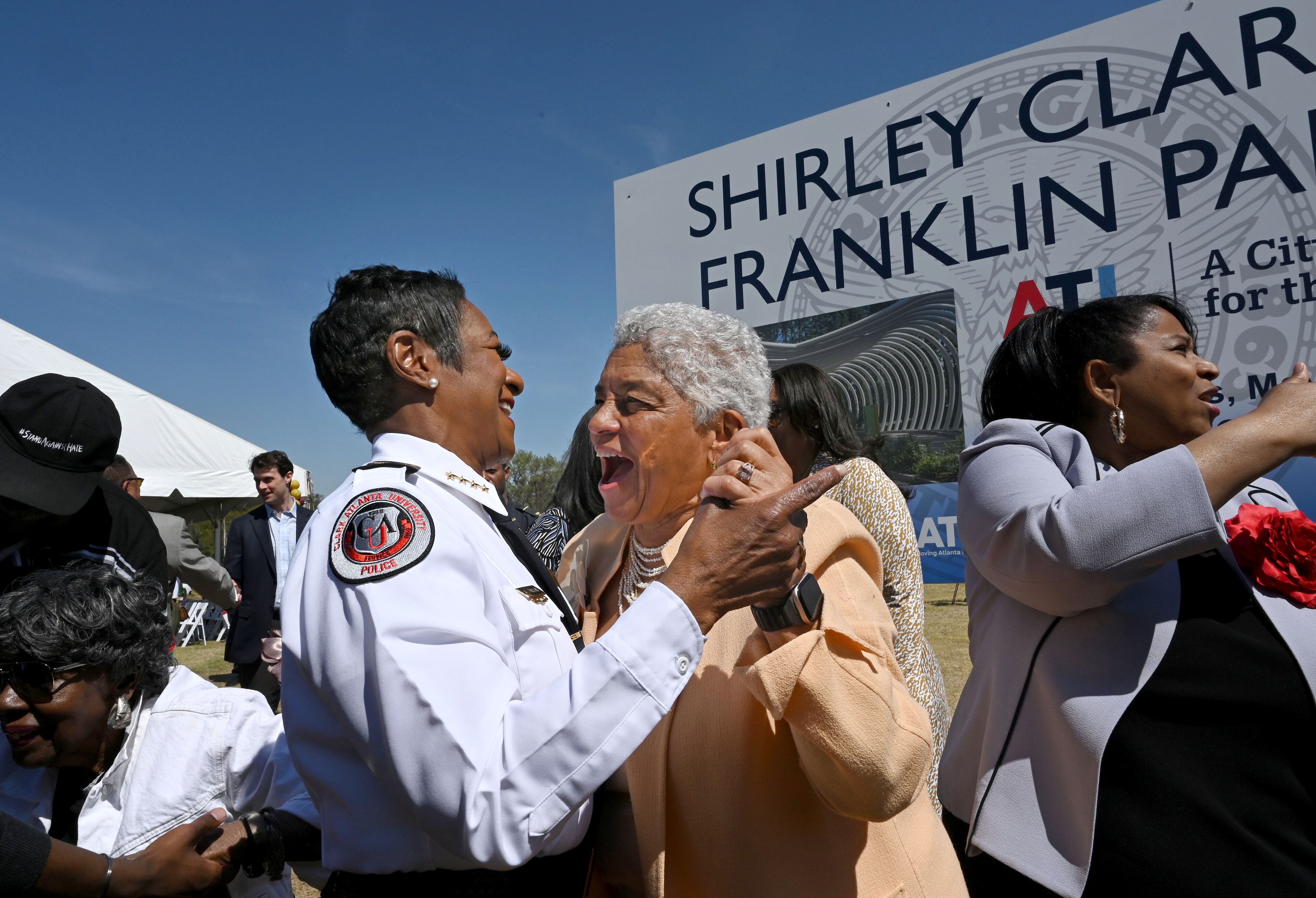 Former Atlanta mayor Shirley Franklin is congratulated by CAU Police Chief Debra Williams (left) during unveiling of Shirley Clarke Franklin Park event March 27 in Atlanta. (Hyosub Shin/AJC)