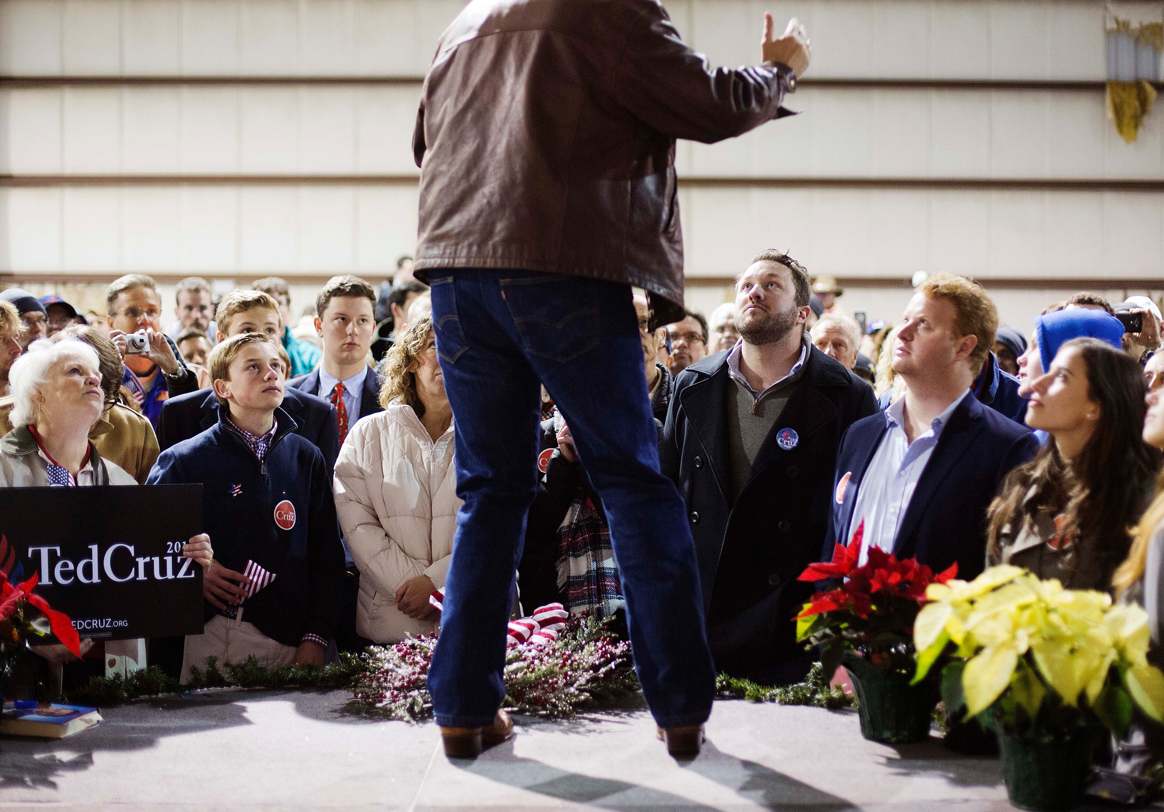 Members of the crowd watch as Republican presidential candidate, Sen. Ted Cruz, R-Texas, speaks during a campaign event in an airport hanger Friday, Dec. 18, 2015, in Kennesaw, Ga. (AP Photo/David Goldman)