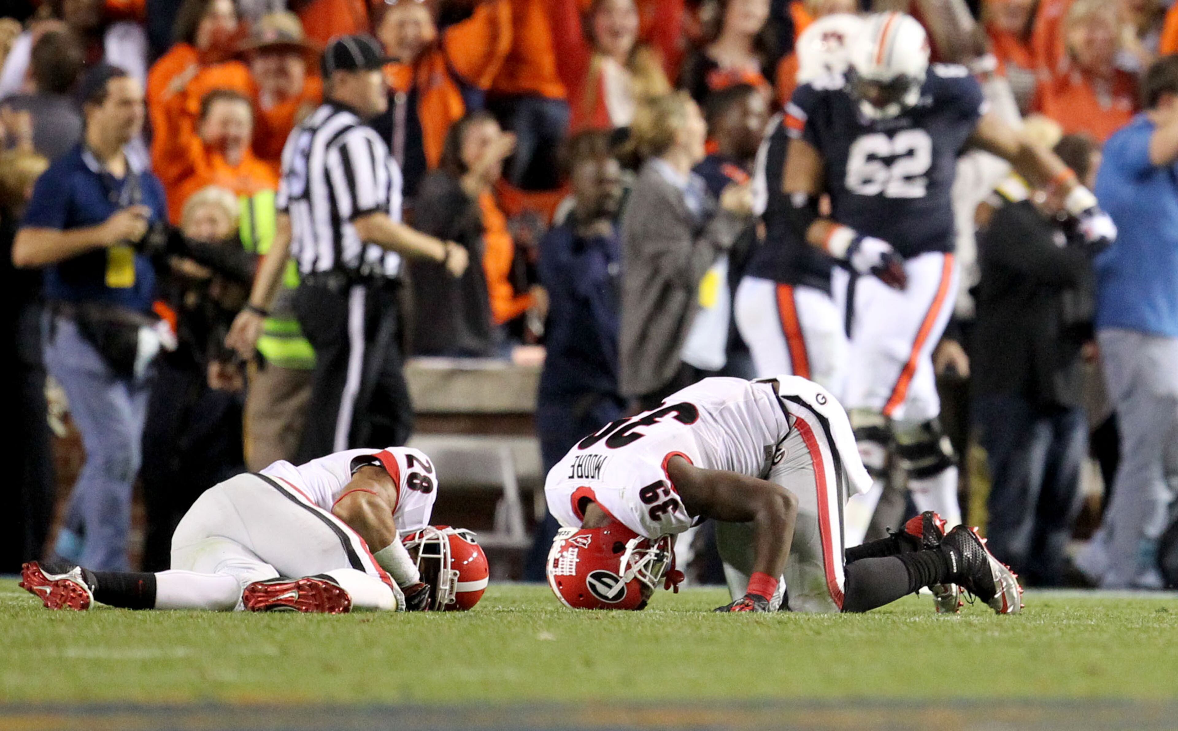 Georgia's Tray Matthews (28) and Corey Moore (39) react after the play.