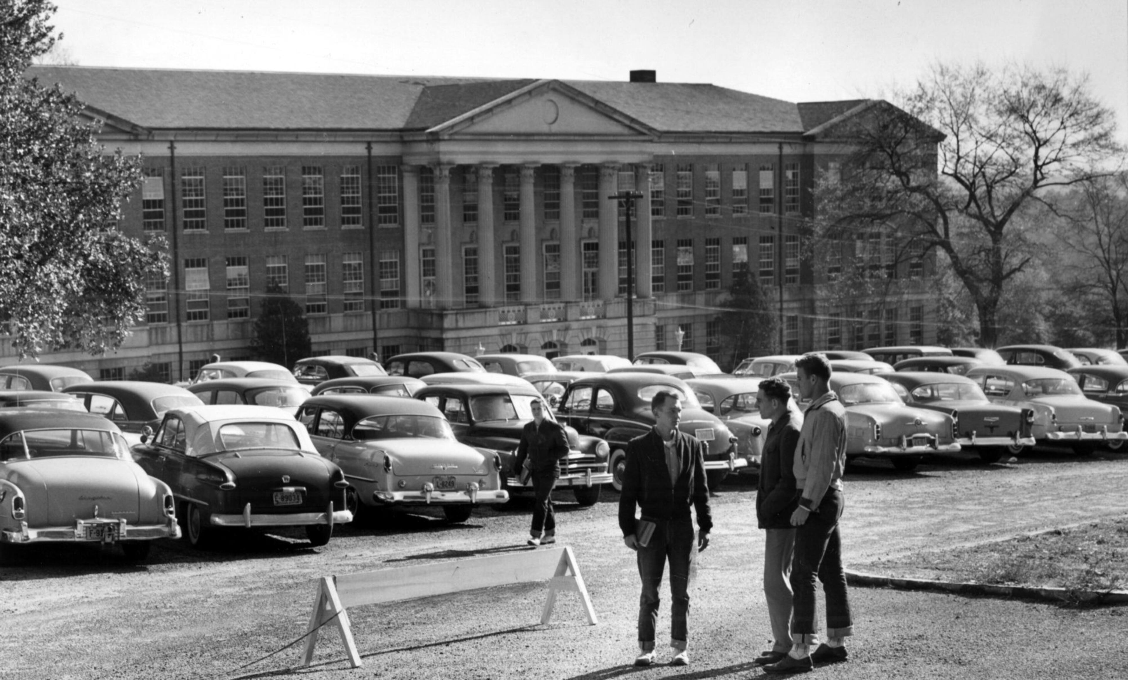 Human remains found at the site of the University of Georgia’s Baldwin Hall halted work on an expansion and renovation project of the 77-year-old building. The unpaved parking lot in front of Baldwin Hall is shown in this historic 1955 photo.