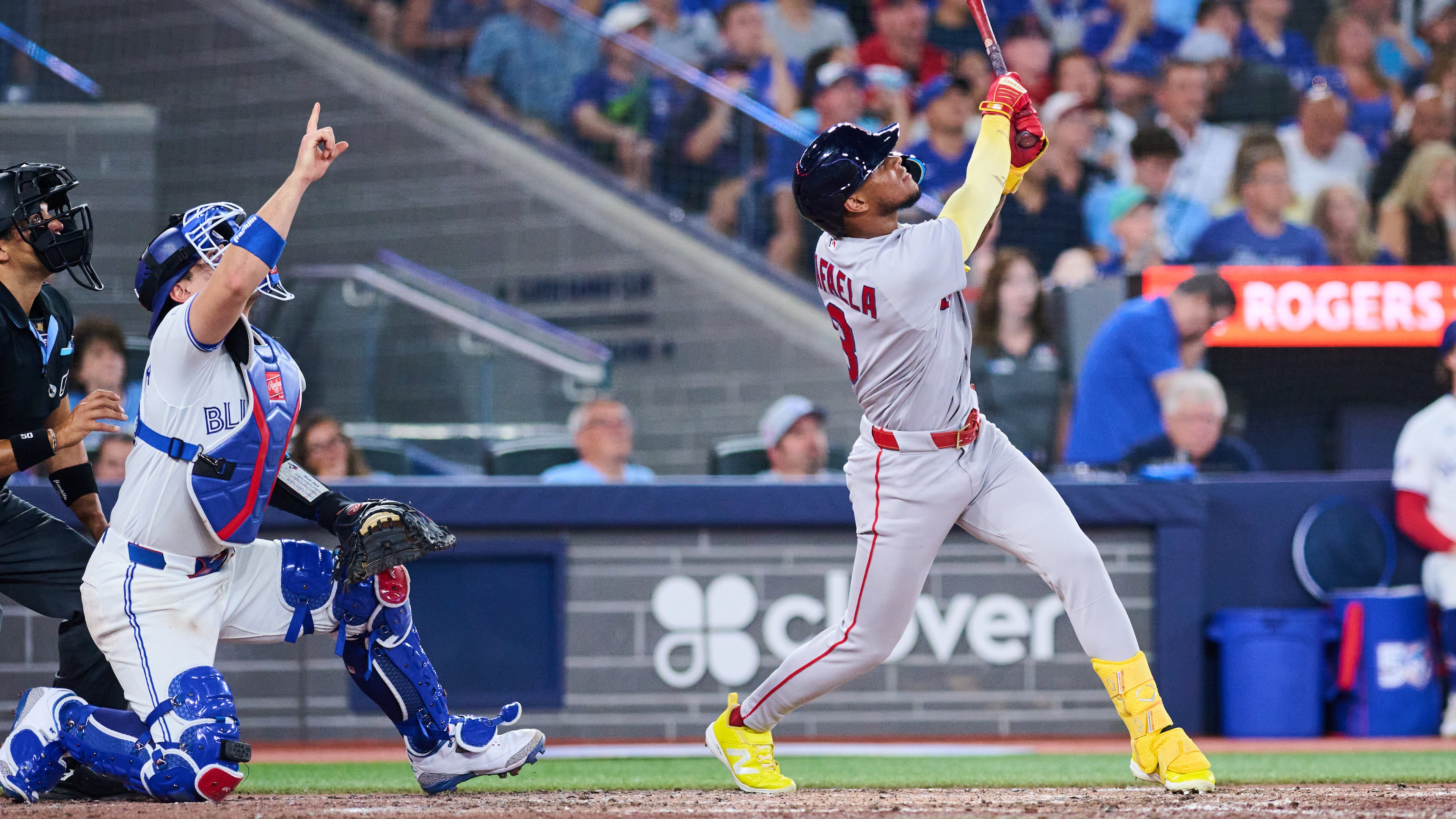 Boston Red Sox's Ceddanne Rafaela, right, flies into a sacrifice double play that was reviewed with a time play allowing Anthony Seigler (not shown) to score against the Toronto Blue Jays during the seventh inning of a baseball game in Toronto, Monday, Aug. 10, 2026. (Sammy Kogan/The Canadian Press via AP)