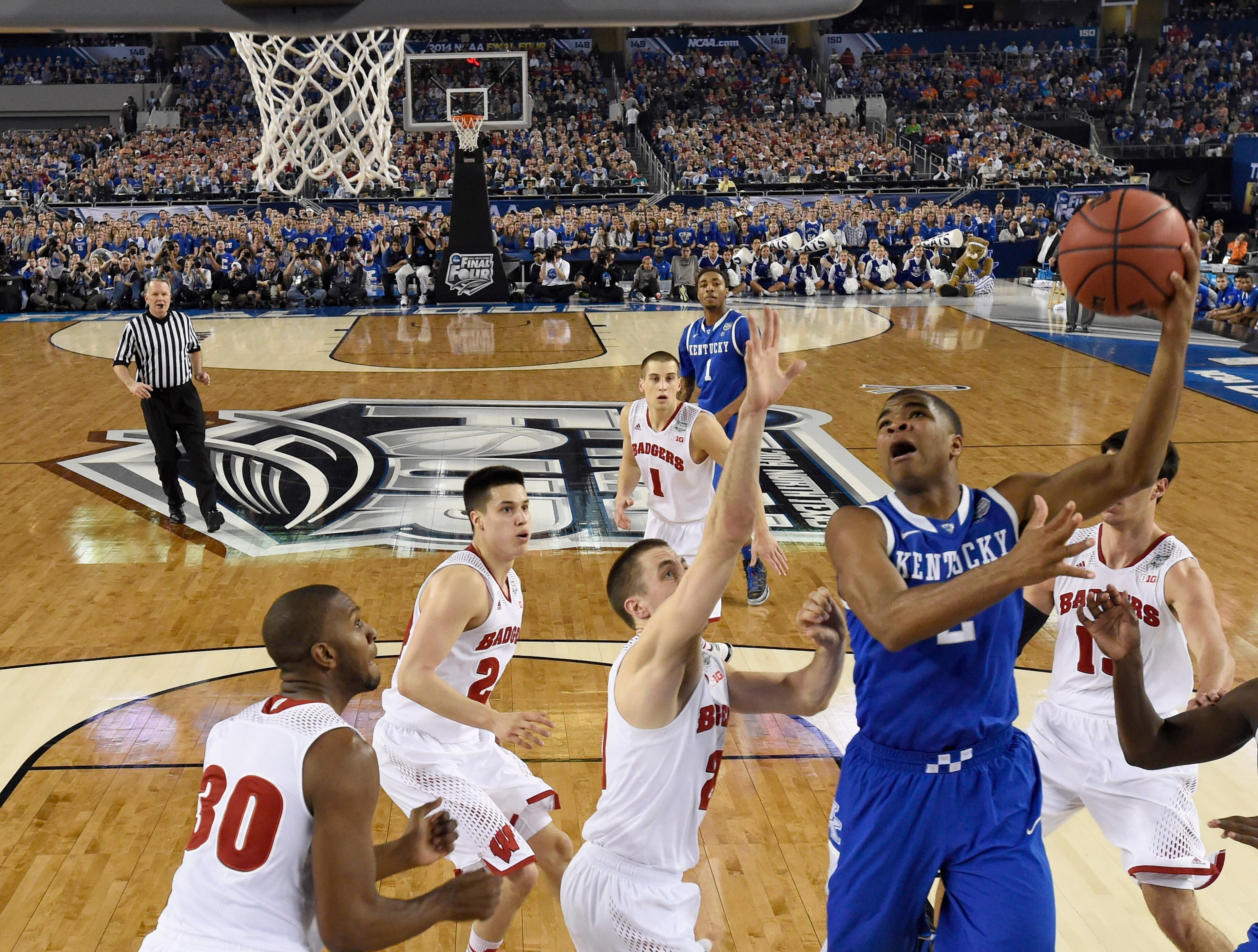 Kentucky guard Aaron Harrison (2) shoots against Wisconsin during the first half of the NCAA Final Four tournament college basketball semifinal game Saturday, April 5, 2014, in Arlington, Texas. (AP Photo/Chris Steppig, pool)