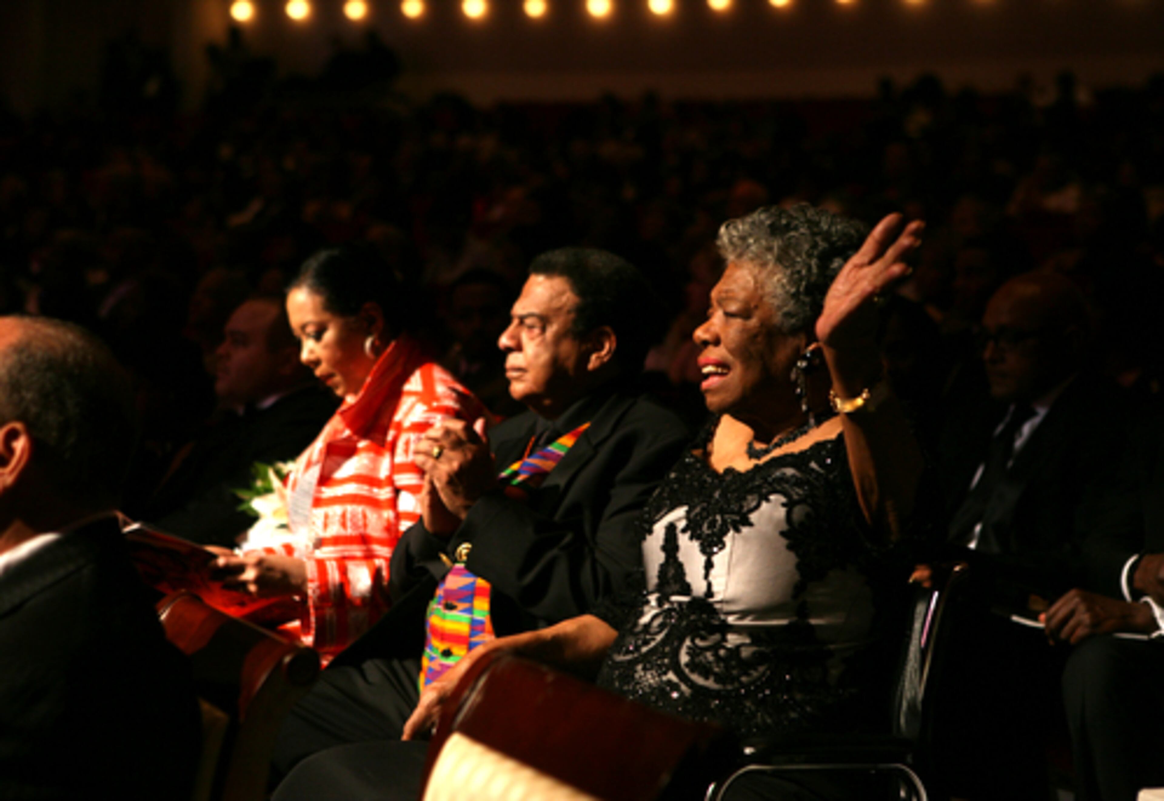 Former mayor and U.N. ambassador Andrew Young, center, and Angelou enjoy the enternaiment portion of the evening.