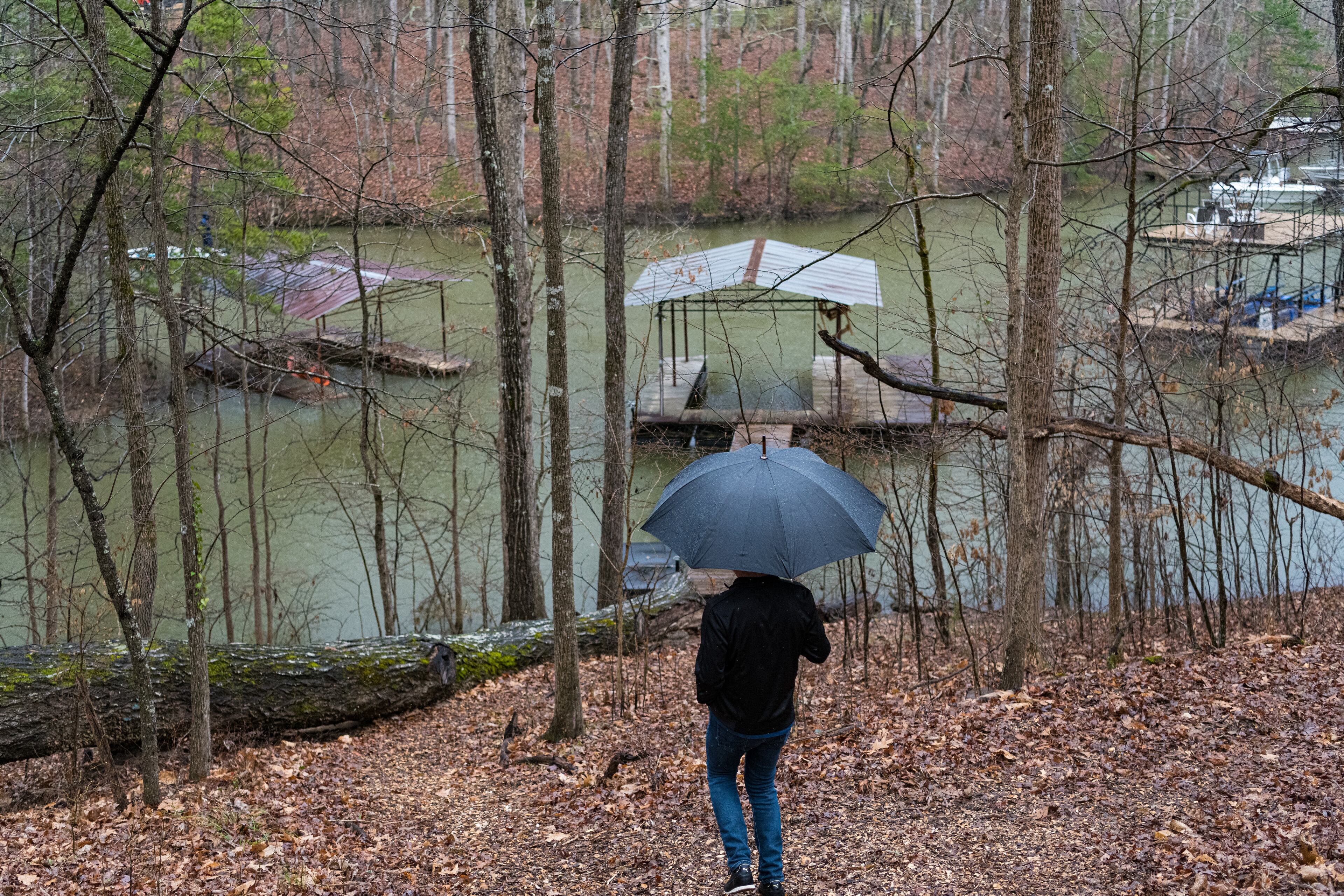Baron Smith takes a walk down to his dock at his Lake Lanier home.