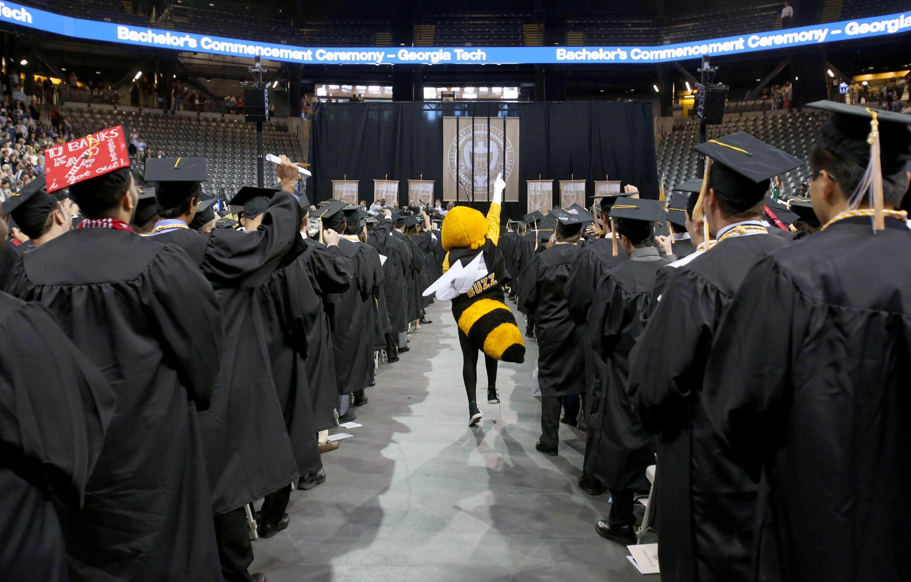 Georgia Tech mascot Buzz runs down the center aisle of undergraduate candidates during the Georgia Tech Bachelor's morning ceremony of Spring 2014 Commencement at the McCamish Pavilion Saturday morning May 3, 2014 in Atlanta, Ga. (Photo/Jason Getz)