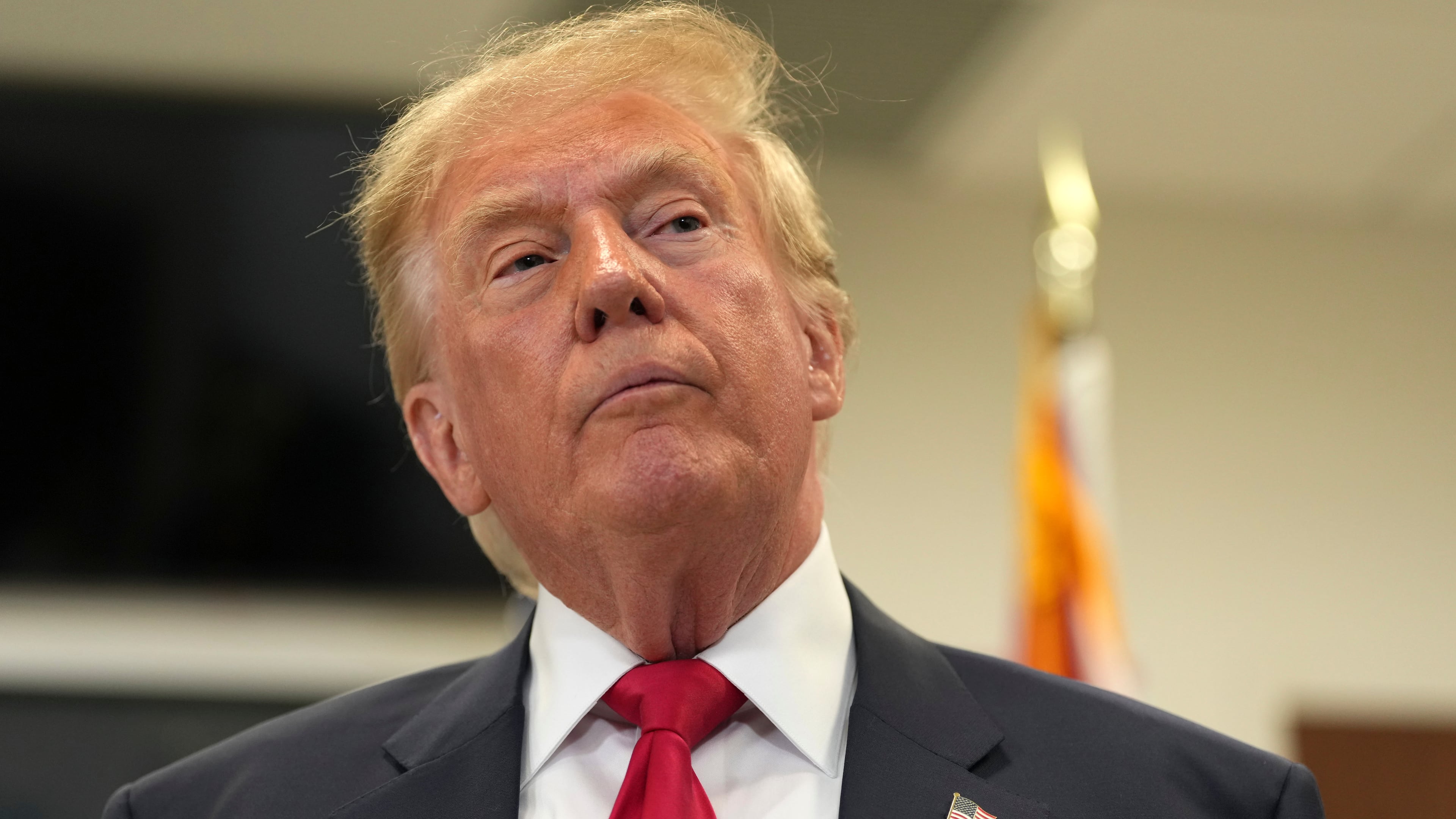 President Donald Trump listens to a question from a reporter after casting his early-voting ballot for the 2026 midterm elections at the Palm Beach County Library in West Palm Beach, Fla., Saturday, Oct. 24, 2026. (AP Photo/Mark Schiefelbein)