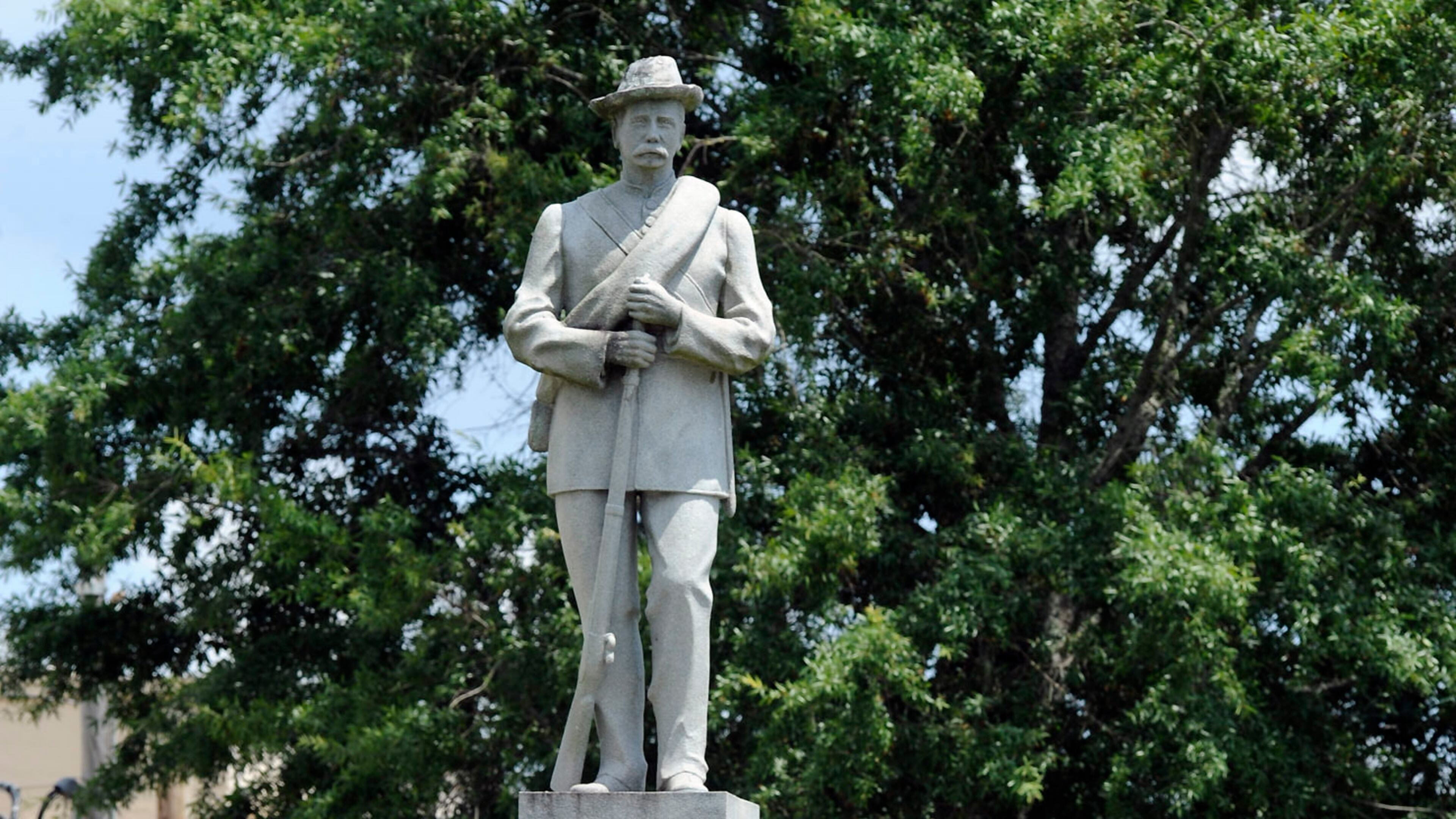 This 2018 file photo shows a Confederate monument dedicated in 1909 standing in the middle of the square in Tuskegee, Alabama. A Tuskegee councilman who once served as the city’s mayor is facing criminal charges after attempting to saw down a Confederate monument in the town square Wednesday.