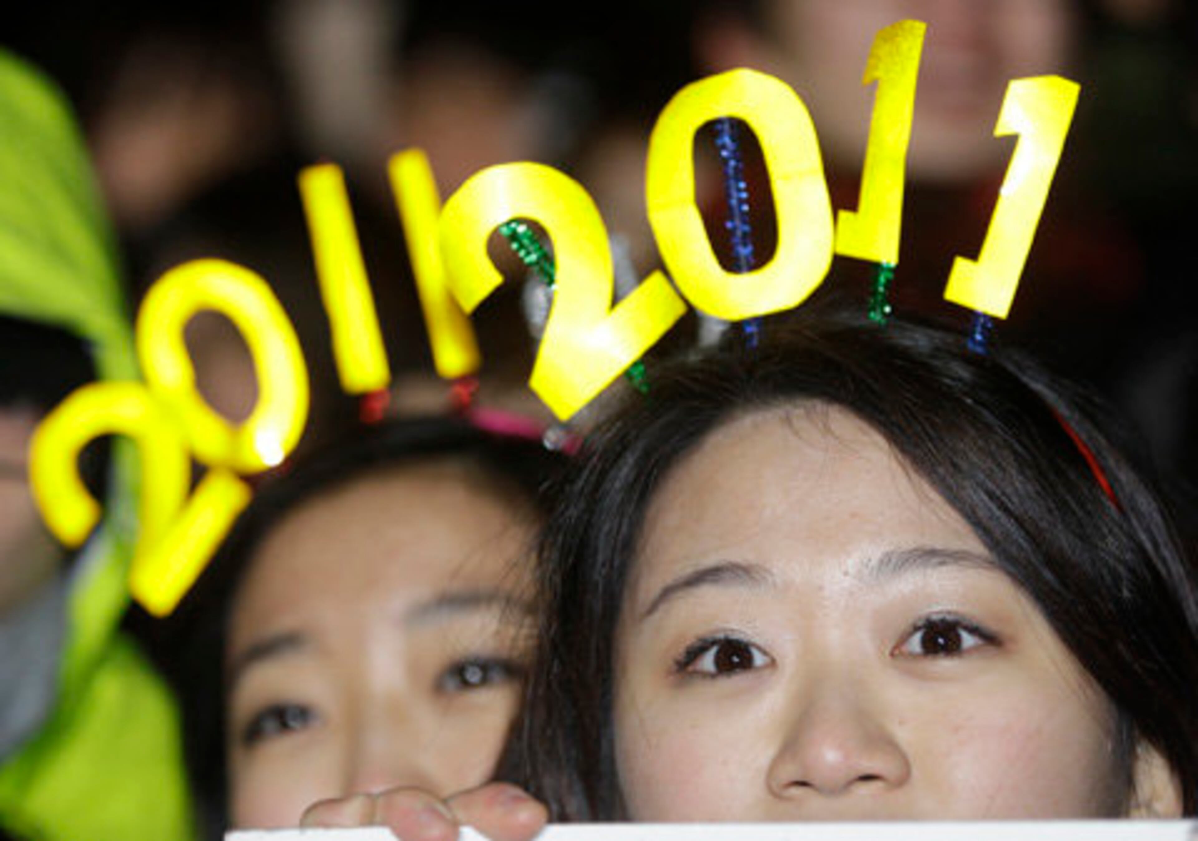 Others donned makeshift 2011 sings to mark the New Year celebrations in Seoul, South Korea.