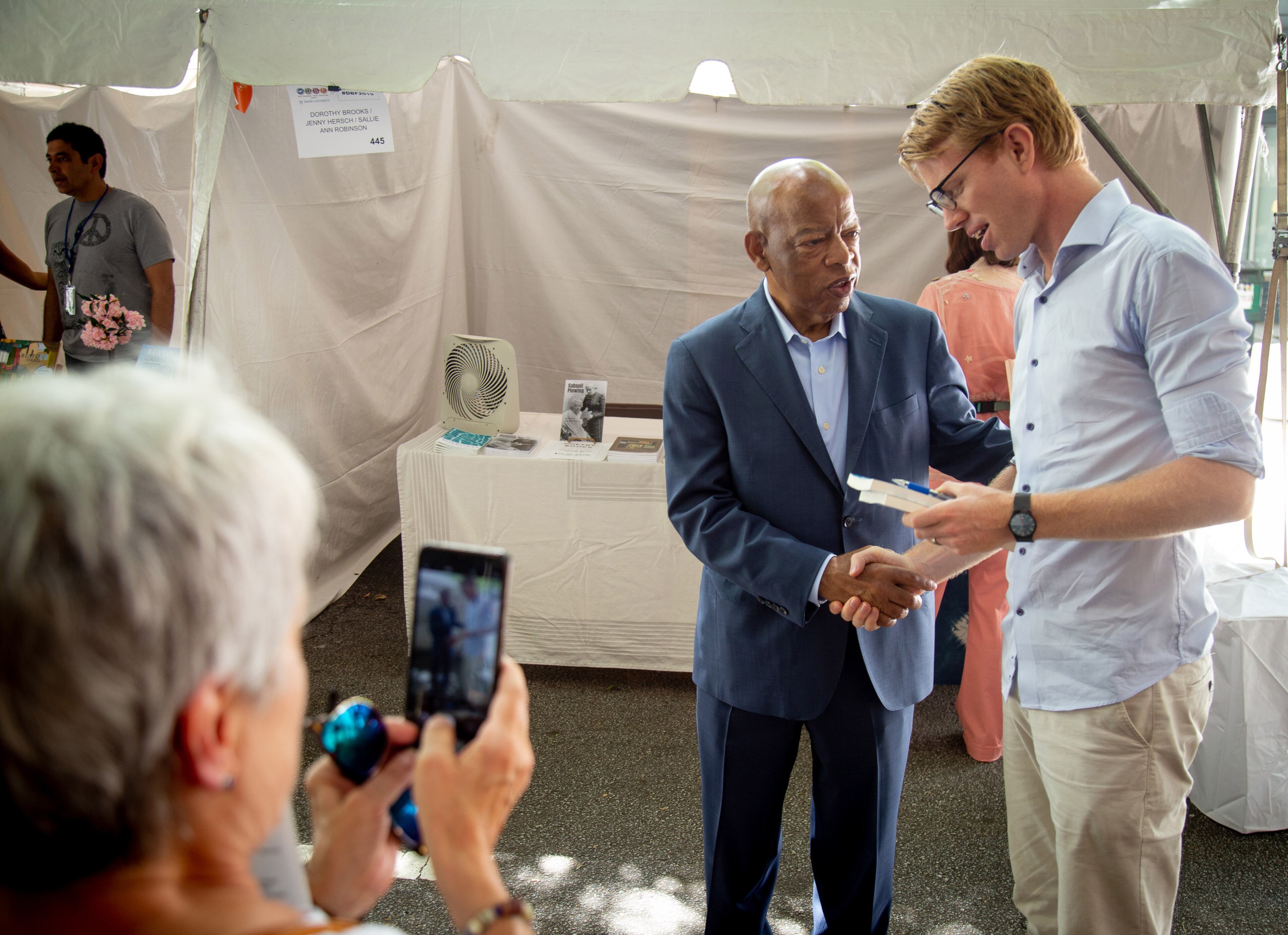 Congressman John Lewis signs books and poses for photographs as he walks around the AJC Decatur Book Festival on Sunday, September 1, 2019. STEVE SCHAEFER / SPECIAL TO THE AJC
