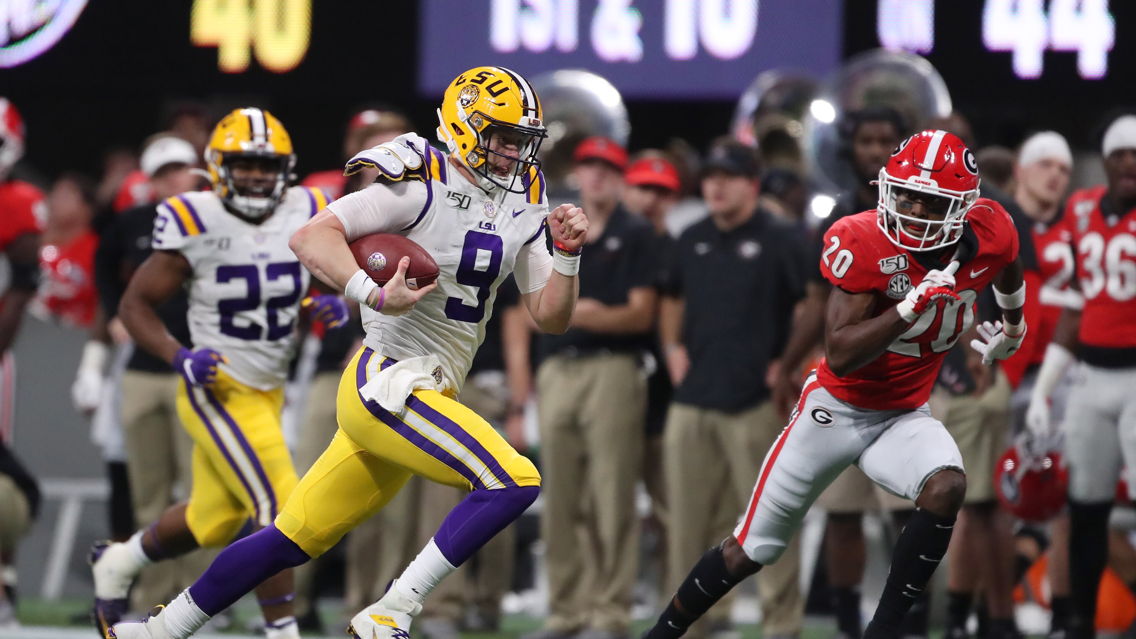 12/7/19 - Atlanta - LSU Tigers quarterback Joe Burrow (9) runs on a keeper play during the first half of the Georgia vs. LSU SEC Football Championship game at Mercedes-Benz Stadium in Atlanta. Alyssa Pointer / alyssa.pointer@ajc.com