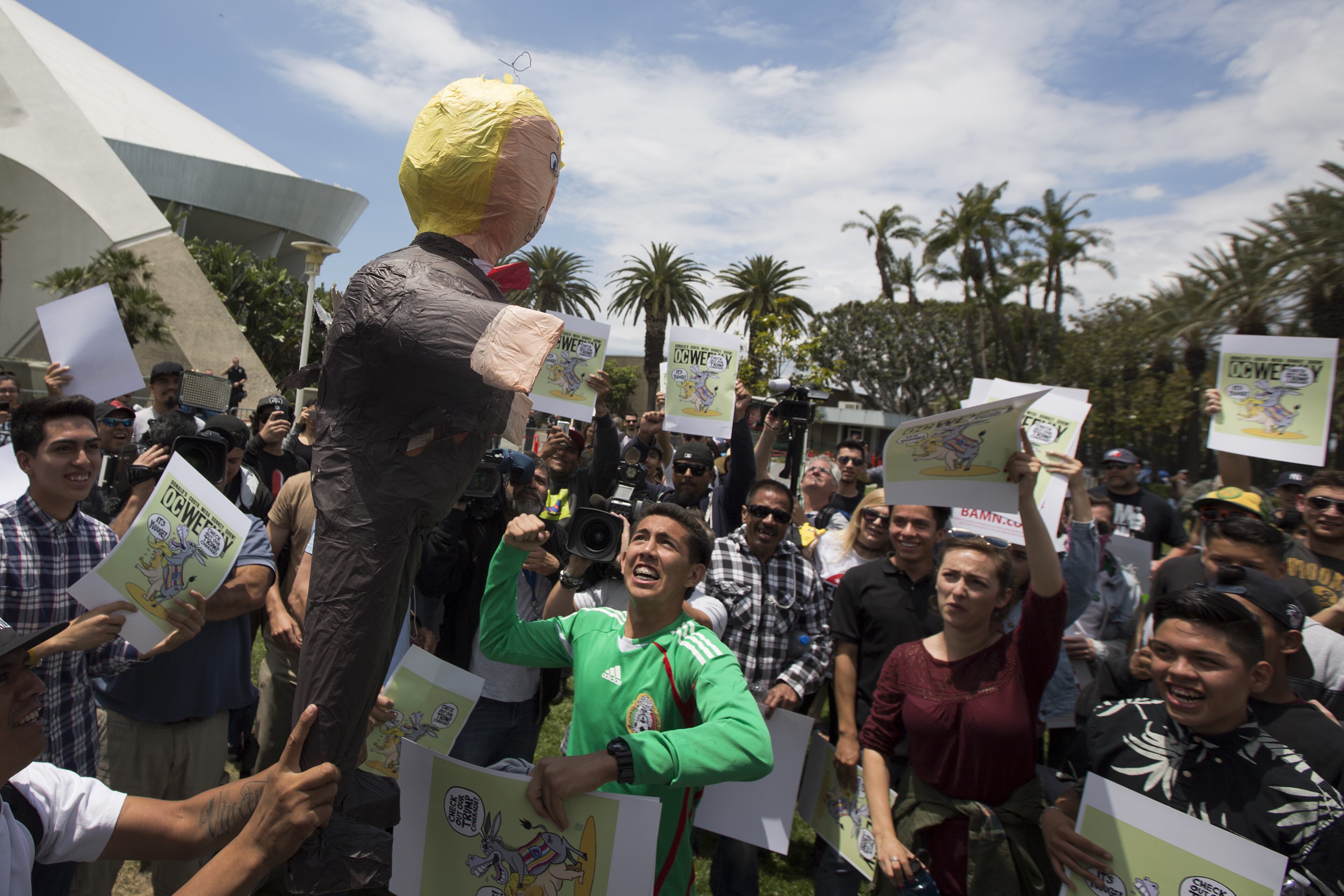 ANAHEIM, CA - MAY 25: A protester punches a Donald Trump pinata near a campaign rally by presumptive GOP presidential candidate Donald Trump at the Anaheim Convention Center on May 25, 2016 in Anaheim, California. Previous visits by the candidate to Orange County have sparked in protests that resulted in some arrests. The presidential candidates are campaigning in Southern California for the June 7 California primary. (Photo by David McNew/Getty Images)