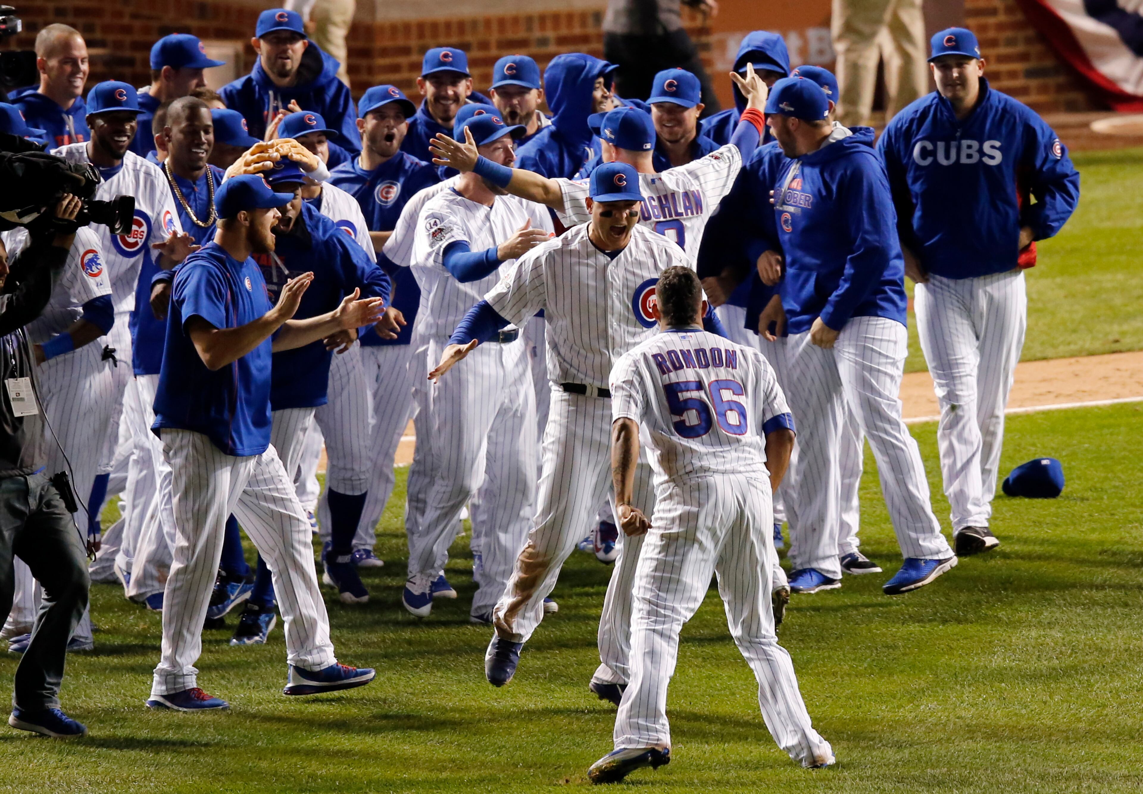 Chicago Cubs players celebrate after winning Game 4 in baseball's National League Division Series, Tuesday, Oct. 13, 2015, in Chicago. The Cubs won 4-6. (AP Photo/Nam Y. Huh)