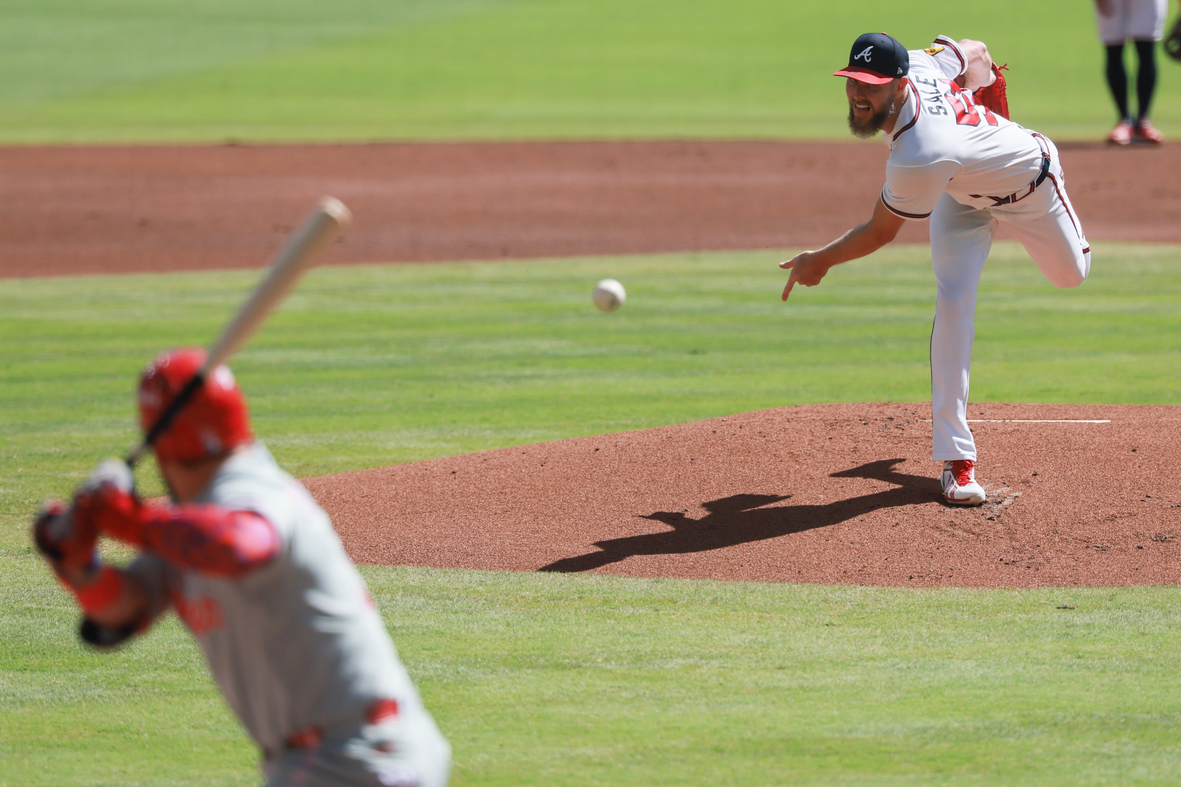 Atlanta Braves pitcher Chris Sale delivers to Philadelphia Phillies designated hitter Kyle Schwarber, left, during the first inning of Game 1 of a MLB National League Wild Card playoff series between the Atlanta Braves and the Philadelphia Phillies, Tuesday, Sept. 29, 2026, in Atlanta. (Jason Getz/AJC)