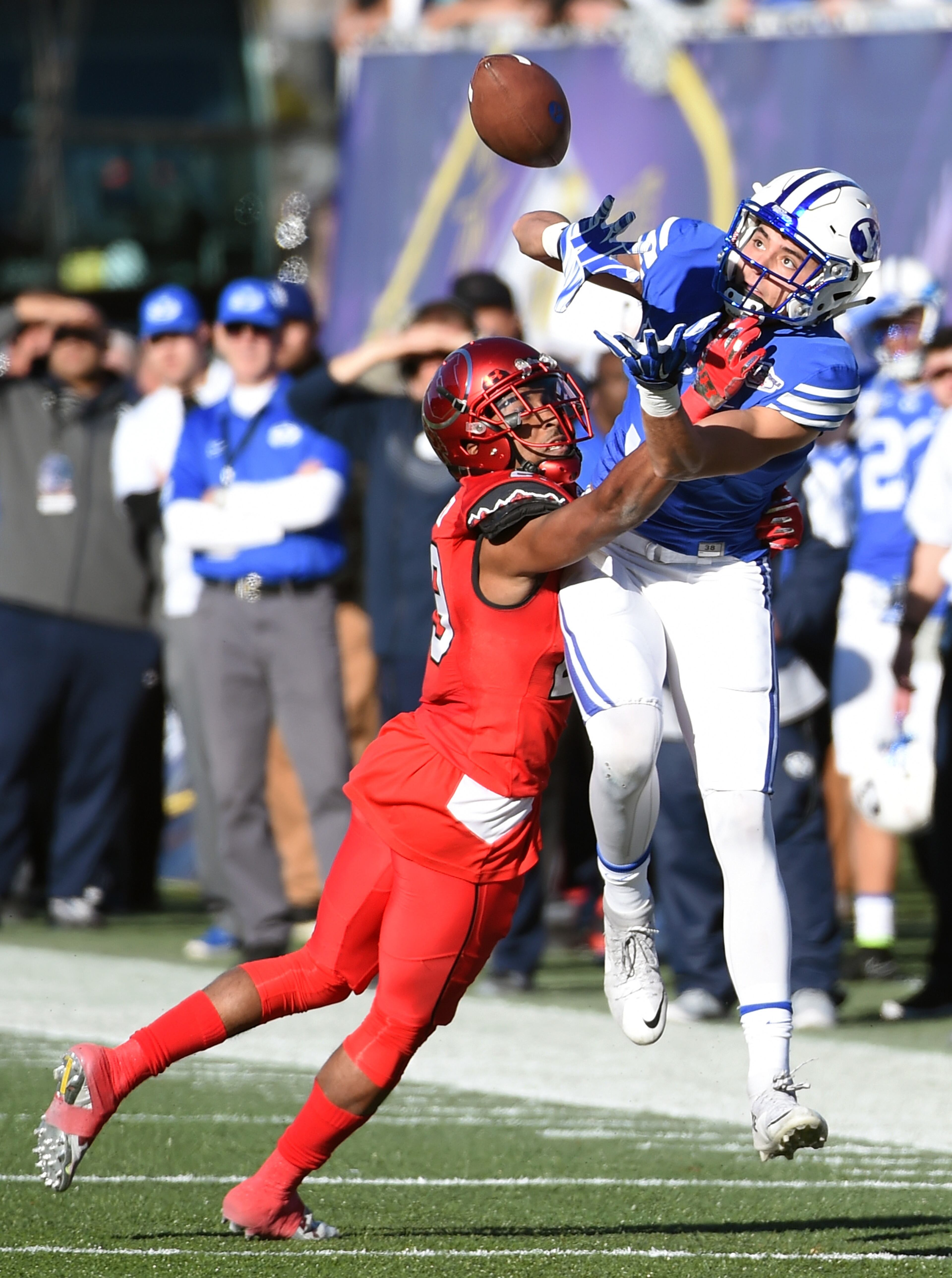LAS VEGAS, NV - DECEMBER 19: Wide receiver Nick Kurtz #5 of the Brigham Young Cougars misses a pass under pressure by defensive back Reginald Porter #29 of the Utah Utes during the Royal Purple Las Vegas Bowl at Sam Boyd Stadium on December 19, 2015 in Las Vegas, Nevada. (Photo by Ethan Miller/Getty Images)