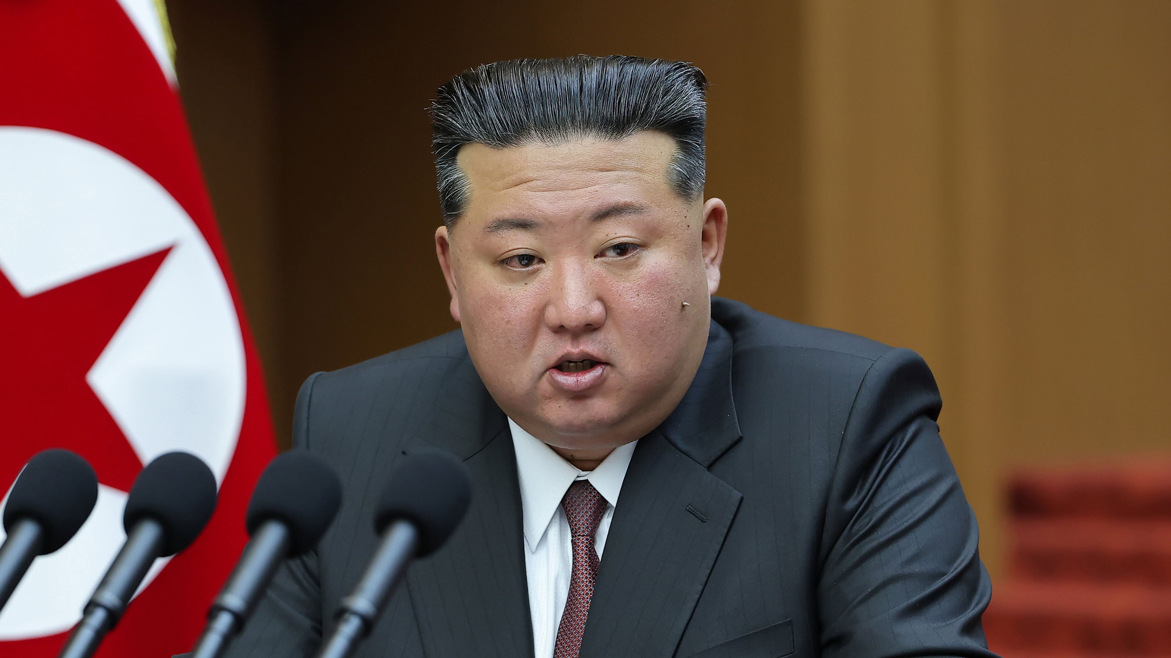 FILE - In this photo provided by the North Korean government, its leader Kim Jong Un delivers a speech during a session of the Supreme People's Assembly at parliament in Pyongyang, North Korea, on March 23, 2026. Independent journalists were not given access to cover the event depicted in this image distributed by the North Korean government. The content of this image is as provided and cannot be independently verified. (Korean Central News Agency/Korea News Service via AP, File)