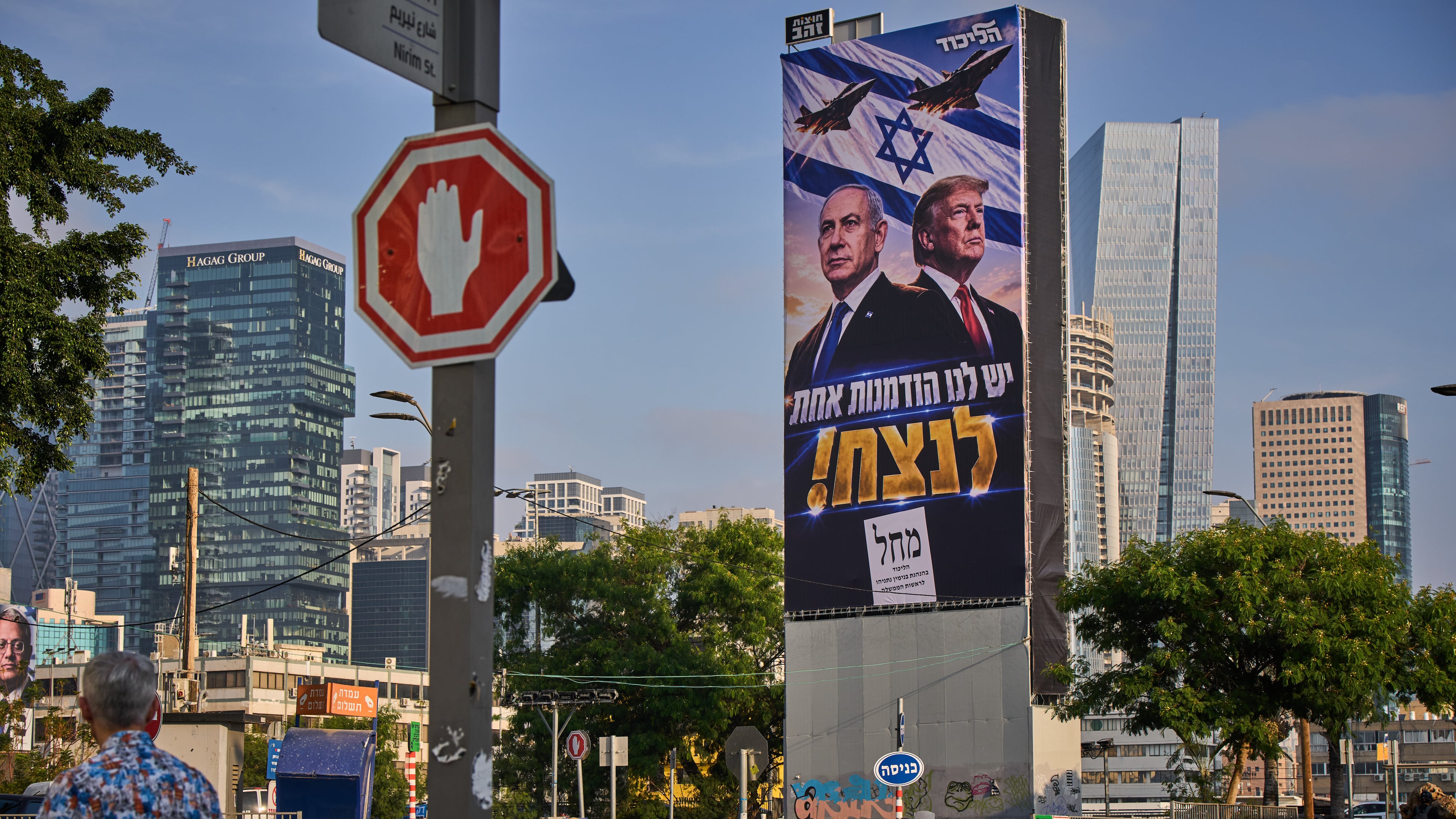 People walk past a Likud Party campaign billboard featuring U.S. President Donald Trump and Israeli Prime Minister Benjamin Netanyahu, with a Hebrew message reading, "We have one opportunity to win," in Tel Aviv, Israel, Monday, Oct. 26, 2026. (AP Photo/Oded Balilty)