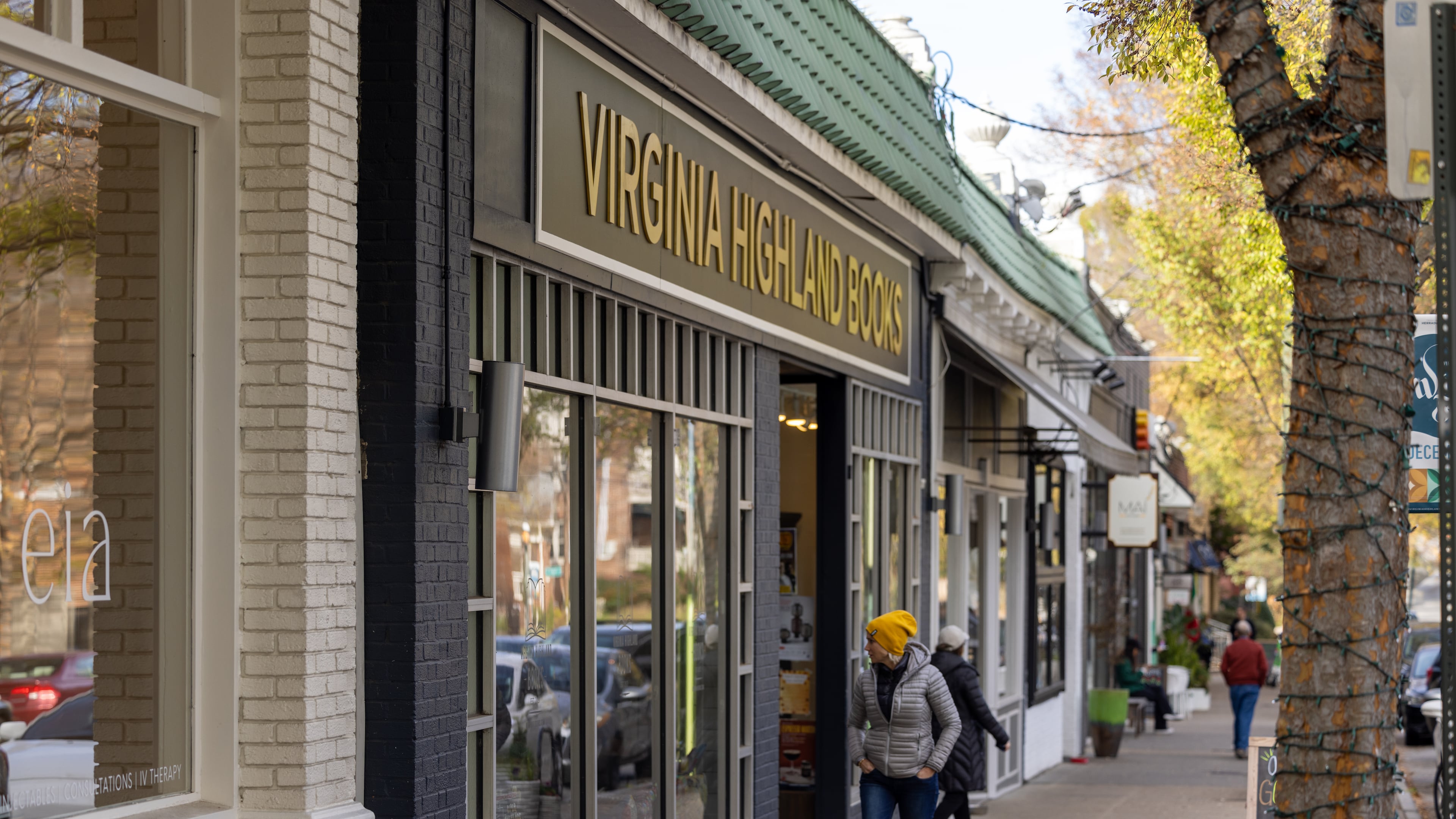 Woman looking into Virginia Highland Books at Virginia Highland on November 20, 2022