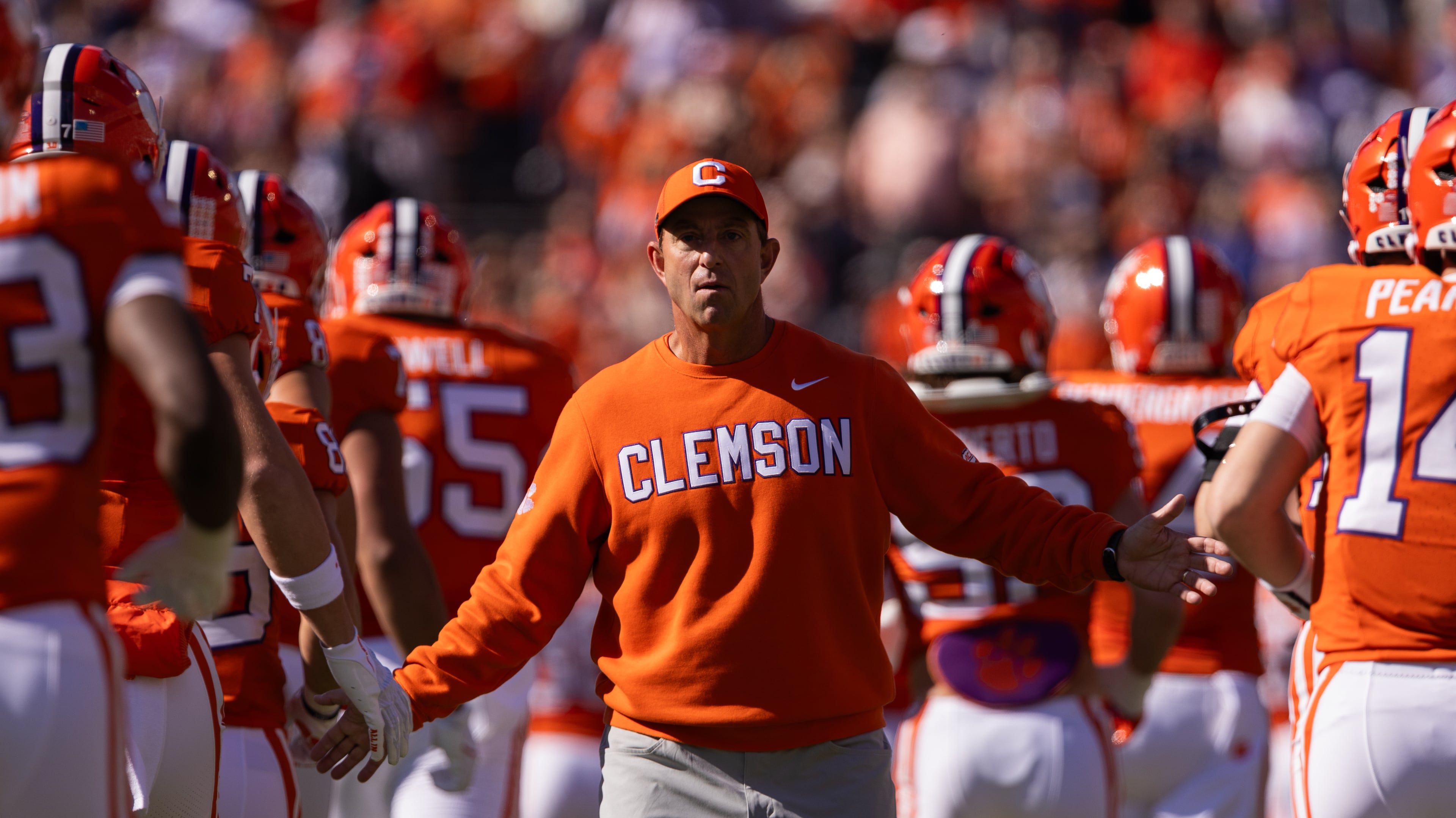 FILE - Clemson head coach Dabo Swinney greets his team before an NCAA college football game against Duke, Nov. 1, 2025, in Clemson, S.C. (AP Photo/Scott Kinser, File)