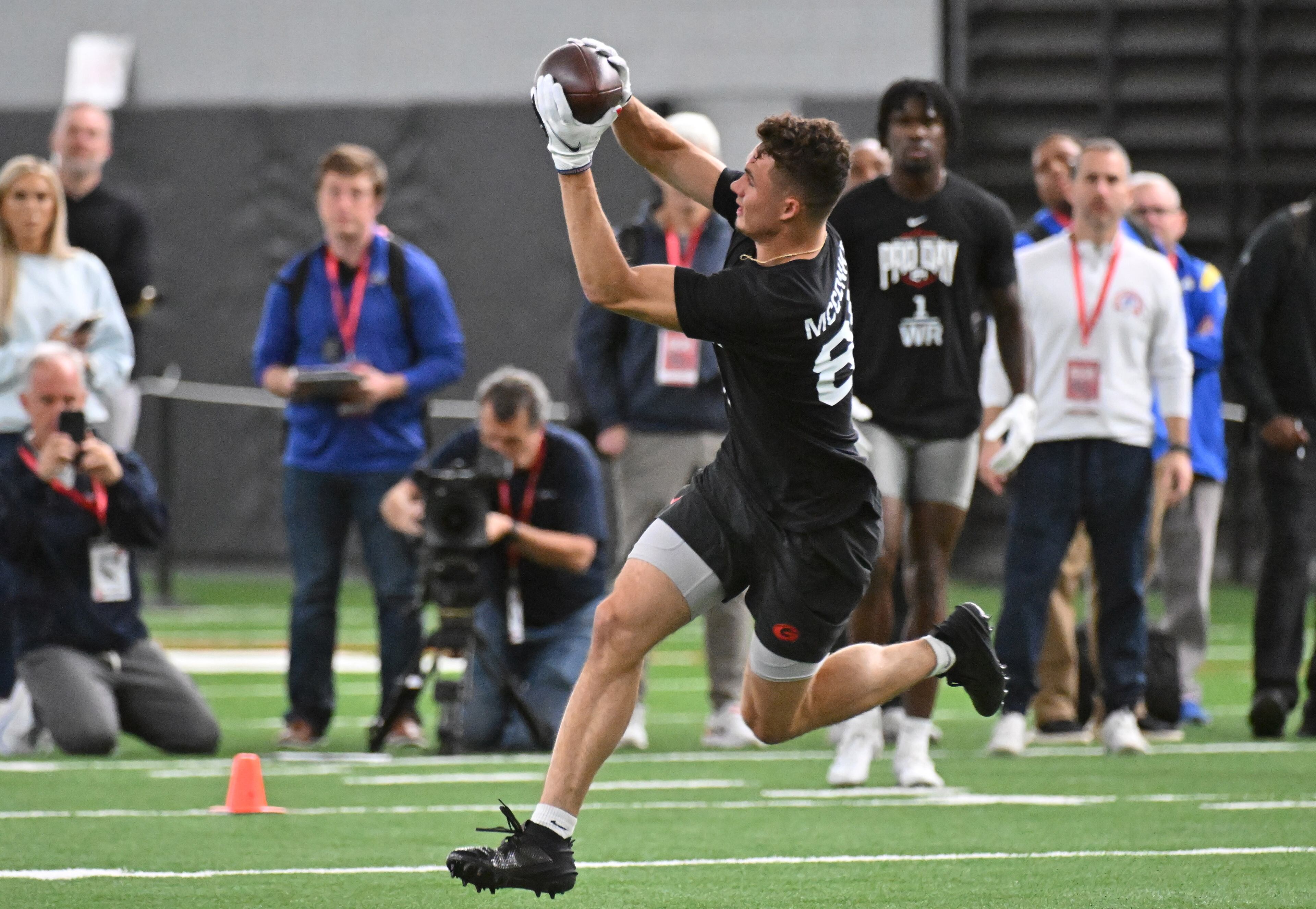 Georgia wide receiver Ladd McConkey catches a pass during Georgia Pro Day at Payne Indoor Athletic Facility, Wednesday, Mar. 13, 2024, in Athens. (Hyosub Shin / Hyosub.Shin@ajc.com)